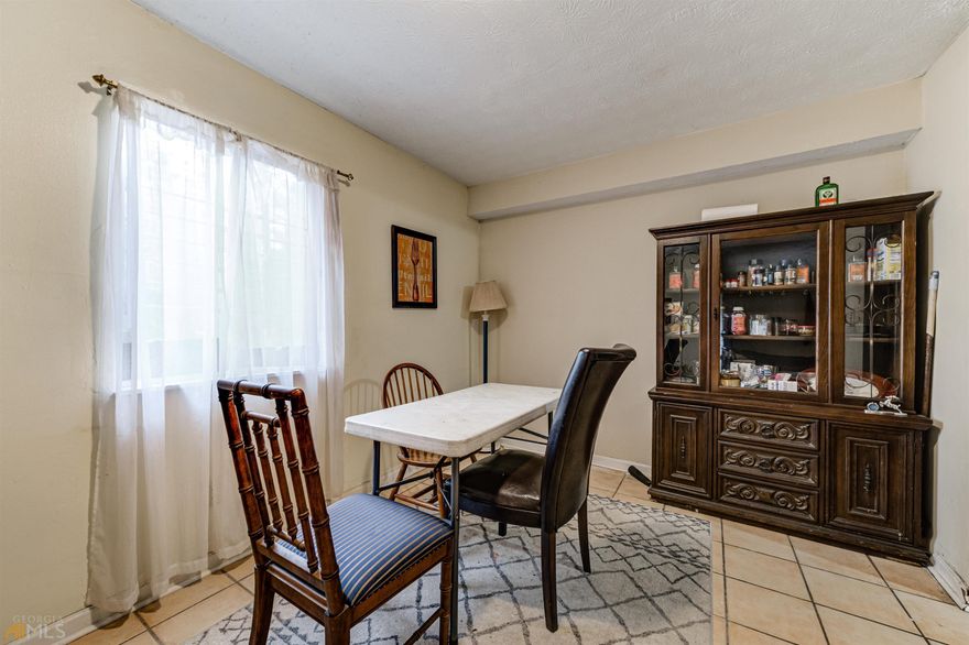 Great find, excellent location. Step from your car into the spacious, open family room. Sliders from the large family room lead to open, covered patio. Large dining area leads to the well-appointed galley kitchen. SS side-by-side refrigerator/freezer, stove, microwave, and washer/dryer. There is a large thru-window from the kitchen to family room. This two bedroom/one bath unit will not last long. Minutes from Emory and Mercer Universities, CDC, and Dekalb Farmers Market. Walking distance to shopping and supermarket. I-285 is just a few blocks away. Very quiet neighborhood. Landscape, insurance, water included in HOA, all you need to pay is electric. Great buy to live in, great investment property to rent out.