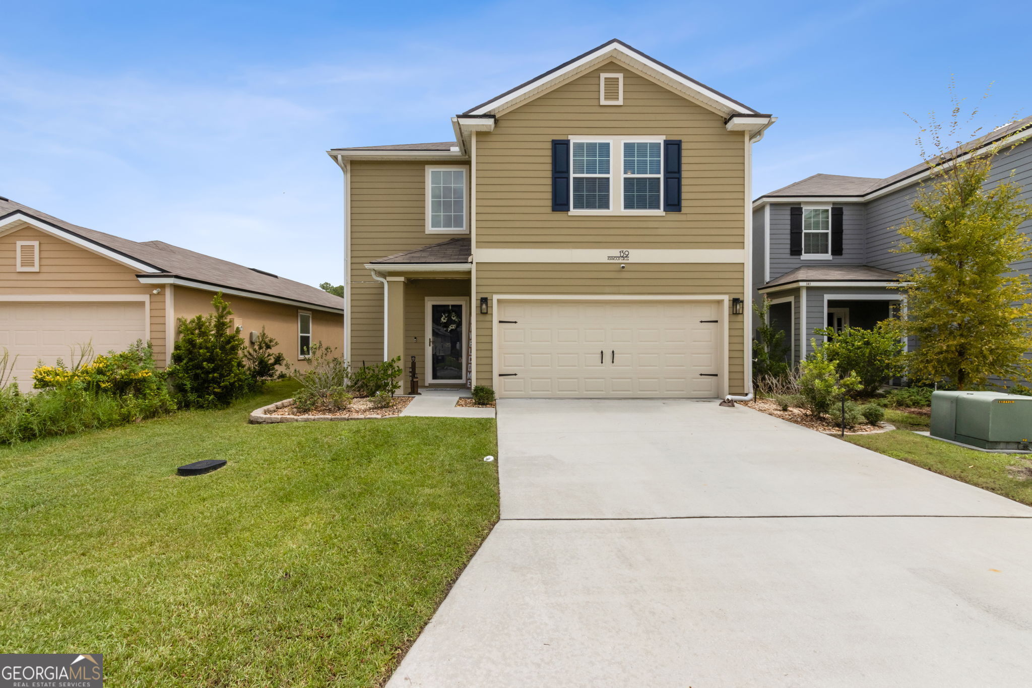 This meticulously maintained 4 bedroom 2.5 bath home, built in 2021, is located just minutes from Kings Bay Naval Base. The main floor and bathrooms feature durable luxury vinyl plank flooring, while the stairs and upstairs bedrooms are finished with cozy carpet. The spacious primary bedroom offers a private en suite with dual vanities and two walk-in closets. Upstairs, you'll also find two additional bedrooms and a full bathroom. A half bath is conveniently located on the main floor. The open-concept kitchen includes a large island, stainless steel appliances, a walk-in pantry, and a reverse osmosis/water softening system. Additional highlights include a two-car garage with automatic opener, smart home technology, and a fenced backyard with views of the neighborhood pond-perfect for relaxing or entertaining. This move-in ready home combines comfort, convenience, and location. This home comes with a 1 year 2-10 Buyers Home Warranty.
