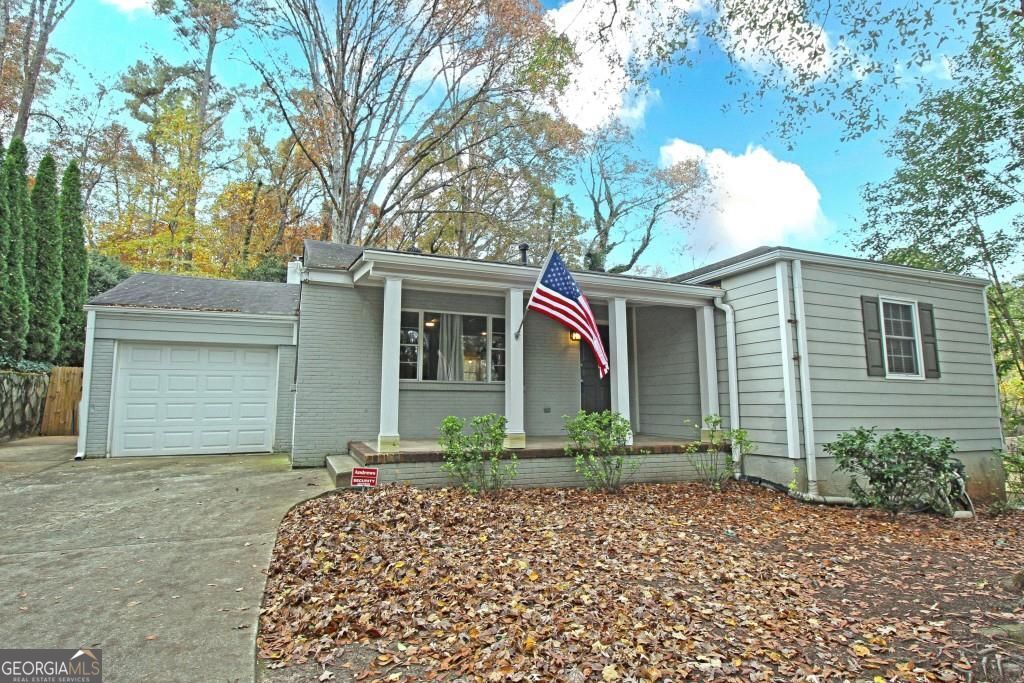 This adorable rustic cottage is the best-kept secret and deal in the sought-after Morris Brandon school district and the very desirable Ridgewood Heights neighborhood. It's close to all things FUN in the West Midtown area including Cross Creek golf course, Publix, The Works, Top Golf, tons of breweries, and more! This charming 3 bedroom, 2 bath home is move-in ready today and it sits on a deep lot that is perfect for future expansion or renovation. The Primary Bedroom includes a walk-in closet and it's own bathroom. The other 2 bedrooms share a full bath. The large family room features high ceilings, wooden beams, a decorative fireplace and wraparound windows with views of the deck and the forest of trees beyond. The open-plan living room and kitchen has an amazing flow that lets you entertain while you cook with family and friends. Recent renovations include stone steps and railing for easy access to the sidewalk, a new retaining wall, refurbished septic, refurbished exterior paint and trim, and a partially fenced back yard that is perfect for cookouts. Avid gardeners will love the flower beds and all the room for making the back yard your personal paradise. The large storage shed at the back of the yard offers great options for gardening, workshop, and other hobbies. The basement with exterior entrance provides additional storage for seasonal decorations and more. The one-car garage and large driveway provide parking for at least 3 cars and the paved turn-around makes coming and going easy and safe. It's an ideal location with easy access to I-75 and Buckhead, Downtown, and West Midtown. You're also a quick drive from the newly opened Westside Reservoir and THE WORKS where you'll find an amazing 13 acres of green space. Truly a must see location and home! New families on a budget and retirees looking to downsize will both want to check out this amazing opportunity to own a home in one of Atlanta's best communities.