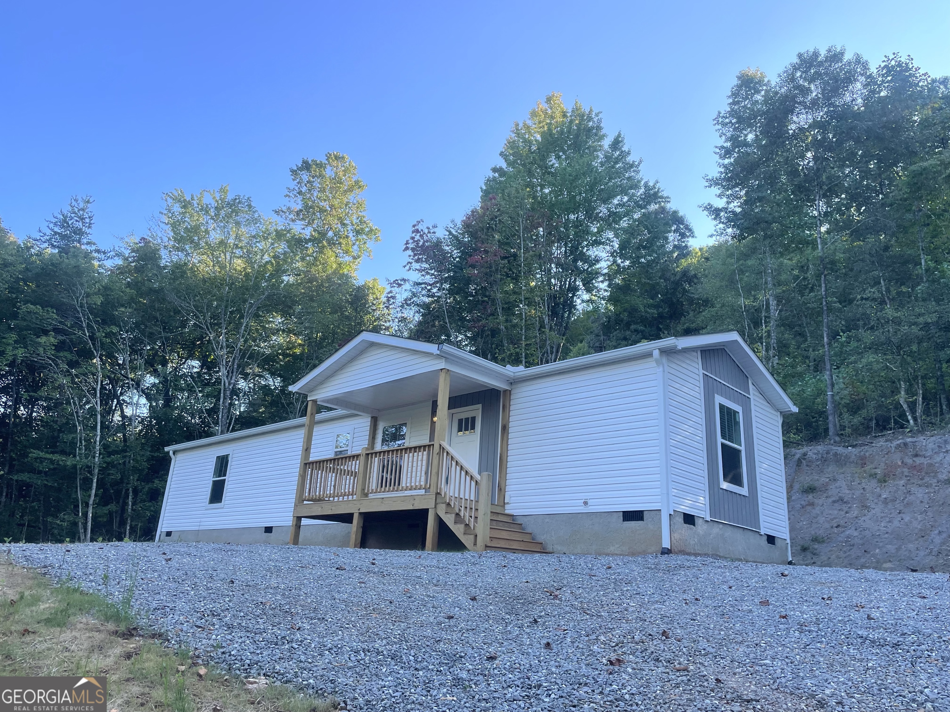 2 Bedroom 2 Bath on 1.07+/- acres in a beautiful community is finally here! With all NEWER Appliances. Fiber Optic now available! Nicely Oaks is located near the Ingle's Grocery in Hayesville, and is very close to Chatuge Boat Ramp, Chatuge shores for the avid golfers, 30 min +/- from the Casino in Murphy! This is a must see- beautiful scenery, an abundance of wildlife , mountain views, and a gorgeous water feature! This home has beautiful drywall throughout, DuraCraft Cabinets, Frigidaire stainless steel appliances ( * * everything but furniture, microwave & washer & dryer * * ), Craftsman style front door, Ecobee Smart Thermostat, double pane windows & window treatments, w/ 2 in blinds, and carrier Furnace. Enjoy your Heavy Duty, freestanding deck for gatherings and BBQ's! The home also features a covered portico! The 3D walkthrough is photos from another Unit in the community. Some photos have been digitally enhanced. Buyer should verify sq ft, 3d walk through/measurements may not be 100% accurate. This community is minimally restricted. Light monthly fee for rd maintenance and shared well, Schedule a viewing today! Priced to sell! GPS 710 Nicely Rd - New addresses do not show up in mapping. From Ingles Hayesville, 500 ft turn rt on to US-64, 0.3 rt on Myers Chapel, 0.2 rt on Nicely rd .
