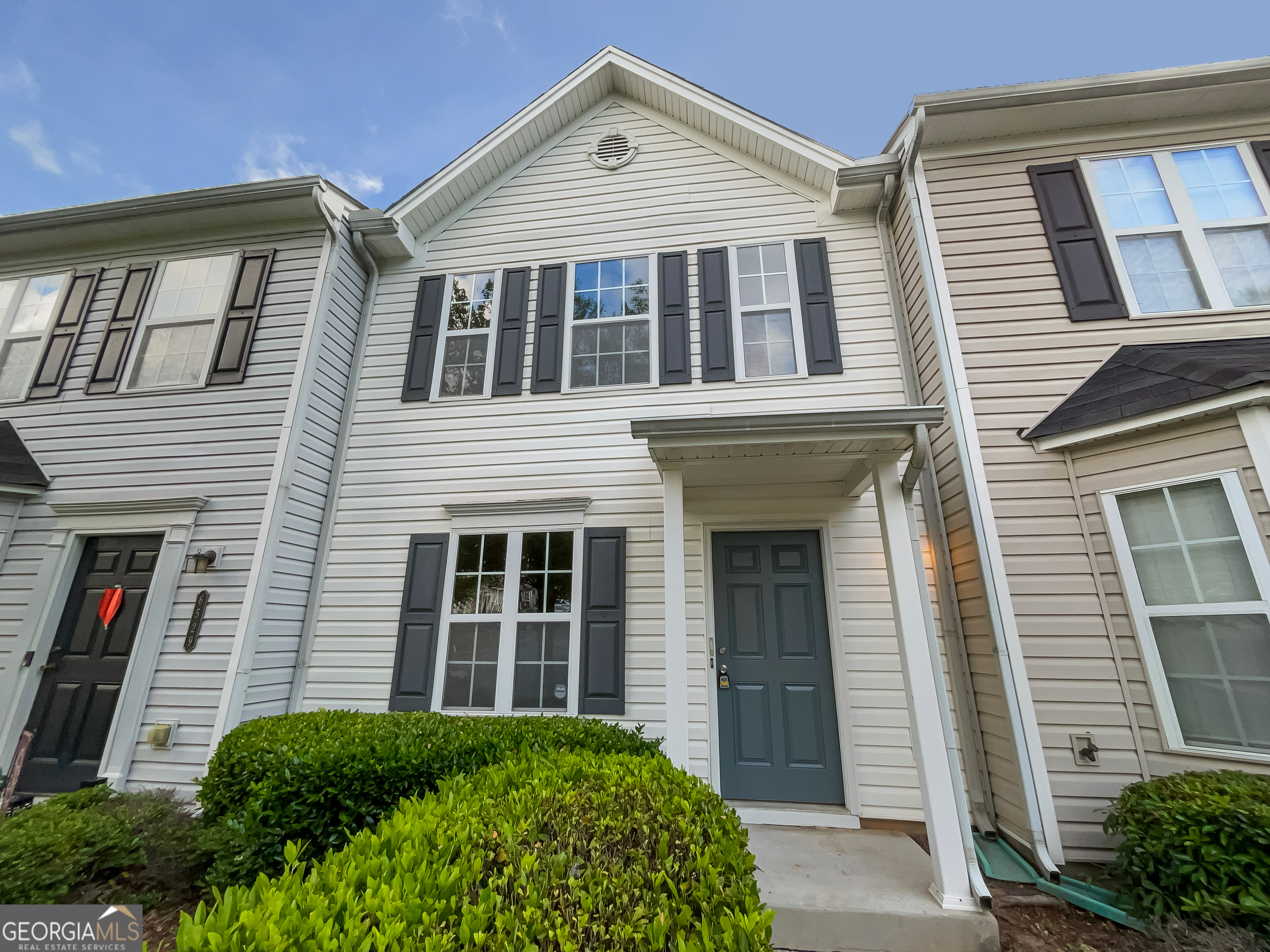 Welcome to this inviting 2-bedroom, 2.5-bathroom townhome located in a sought-after gated Arbor Gate community. Designed with both comfort and convenience in mind, this home offers a functional layout, modern updates, and a fantastic Mableton location close to everything you need. The main level features a bright, open-concept floor plan where the family room with cozy fireplace flows into the dining area and kitchen, creating the perfect setting for entertaining or relaxed everyday living. The kitchen is well appointed with stained cabinetry, stainless steel appliances, a breakfast bar, and plenty of counter space. Upstairs, a spacious loft area provides flexibility-ideal for a home office, study space, or relaxation nook. Both bedrooms are designed for comfort and privacy, each offering its own full bath. The primary suite is a true retreat, complete with a walk-in closet and a bathroom featuring a separate tub and shower. Additional highlights include upstairs laundry for added convenience, as well as a private patio with attached storage room, perfect for outdoor living or extra storage. Enjoy the security and ease of gated community living while being just minutes from I-20, shopping, dining, and parks.