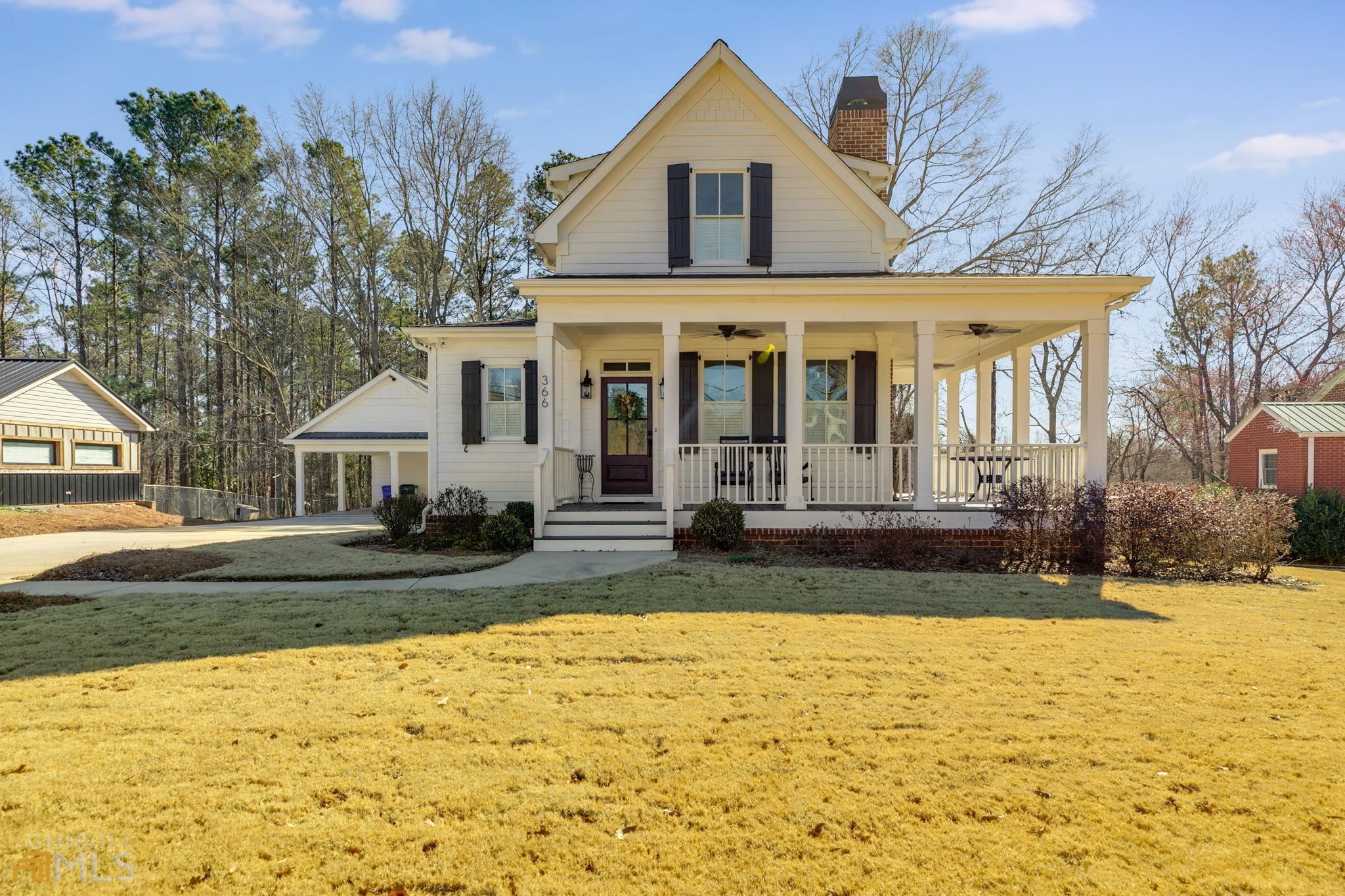 Welcome home to the Sugarberry Cottage! This custom Southern Living Plan has everything you ever dreamed of in a home! This home is located in Bremen City limits close to all things Bremen! As you walk into the front door you notice the open floor plan of the kitchen, dining and living room! The main level features real hardwoods and tiled floors throughout! The gorgeous kitchen features quartzite countertops (which is a natural stone) with a HUGE kitchen island as the focal point with bar seating, farmhouse sink and a gas range stove! The Master Bedroom with his and hers closets. The master bath with a free standing tub, tiled separate shower, separate toilet room and a double vanity with solid surface countertops! There is a gas tiled fireplace located in the living room. The mudroom with laundry has a quartz counter and is located near the master bedroom and also features a private deck coming in from the backyard! You can find plantation wood shutters on the exterior and wood blind shutters all throughout the interior of this home! The upstairs features luxury carpet throughout, 2 HUGE rooms with one full tiled bath. Both bedrooms upstairs have his and hers closets as well! The exterior has so much to offer- hardy plank siding, trex deck boards on the wrap around porch and back porch, 2 car carport with extra storage that features a loft for even more storage if needed, a fire pit with concrete slab, sodded yard, and so much more!!! Make your appointment to view this GORGEOUS cottage home today! I promise you won't regret it!! ***Some pictures have been added to show the landscaping during the summer months***