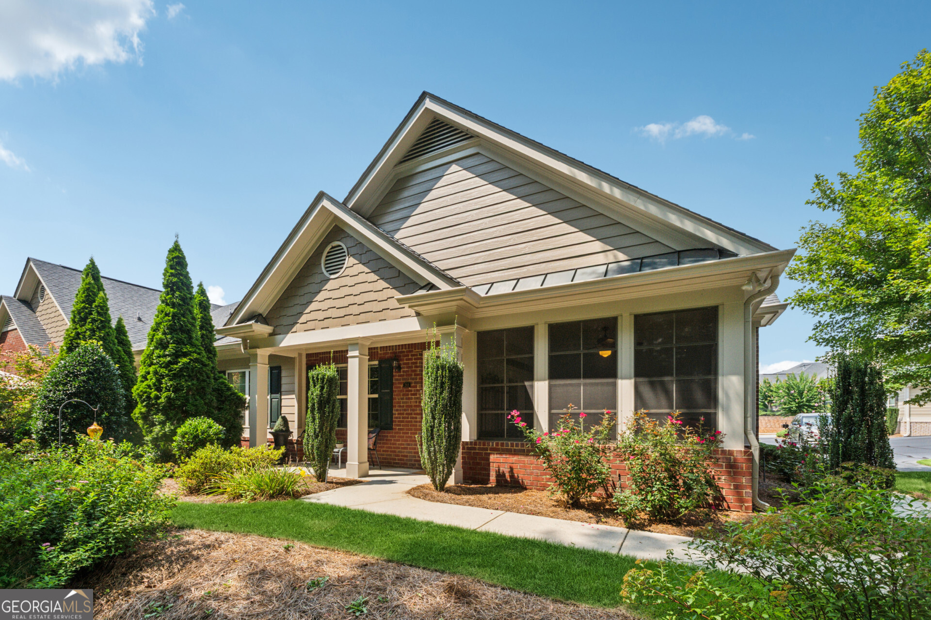 Welcome to The Orchards of East Cherokee! Enjoy the privacy of this quiet wooded corner in a sought after active adult community. Many builder upgrades, including beautiful trim, trey ceilings, chair rail and custom built-in cabinets in the great room, custom built ins in the pantry, master closet and laundry room. The kitchen features an extra wall of cabinets, stainless steel appliances and granite counter tops. Hardwood floors in the kitchen, dining and living rooms. Relax and enjoy your morning coffee while taking in the natural view in the comfortable three season room. This community offers a aintenance-free lifestyle, with the HOA maintaining lawn care, painting, and roofing. Community includes a clubhouse with a fitness area and kitchen adjacent to the community pool. Its prime Woodstock location is close to dining, shopping, and the convenience of the public library and Northside Cherokee hospital.