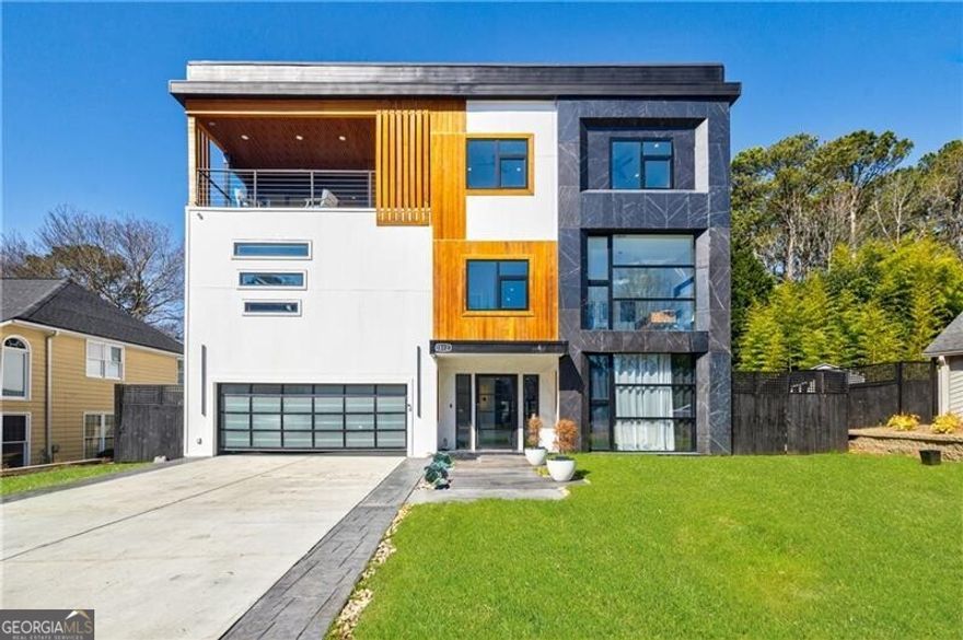 MOTIVATED SELLER. ALL OFFERS CONSIDERED. This breathtaking modern home, built in 2023, offers an array of outstanding amenities that set it apart from the rest. With six spacious bedrooms and six bathrooms, the en-suite is a true standout feature. The open-concept design boasts a two-island kitchen. A 24-foot bifold door, expertly blending indoor and outdoor living. The main floor features one bedroom and a shared bathroom, perfect for guests. Laundry Room. A convenient 4-stop elevator services all levels, including the unfinished rooftop. Outside, the newly designed pool with integrated hot tub is the perfect spot to relax and unwind. The backyard is an ideal setting for families, with ample space for adults and children to enjoy. Throughout the home, natural sunlight streams in through European windows with high-efficiency ratings. The second floor is a true showstopper, featuring a lavish owner's en-suite bedroom. As you ascend to the second level, you'll be impressed by the stunning engineered glass floor. To the left lies a spacious office with sitting area, while to the right awaits the expansive bedroom. Second Laundry room. The third level completes the home with four additional bedrooms, four bathrooms, and a living room. Three Tankless Water Heaters For the ultimate in luxury, take the elevator to the rooftop, where you can create your own private oasis tailored to your lifestyle. Sought after WALTON HIGH SCHOOL district. Conveniently located to Publix, Kroger, Whole Foods, Trader Joe's, Home Depot, Verifiable proof of funds or Pre-Qualification letter prior to showing.