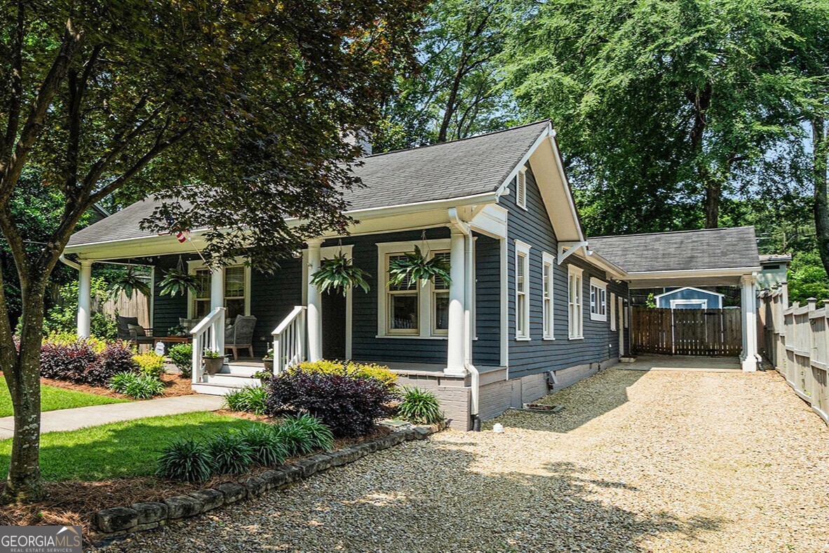 Welcome to this Picture-Perfect, Single-Level Bungalow nestled in the highly-sought after Cherokee Heights neighborhood, where Historic Charm meets Modern Style in one of Marietta's most iconic communities. Just a quick stroll to the Marietta Square, Kennestone Hospital, and all the Shops, Restaurants, and Parks that make this area so special, this home offers the perfect balance of Character and Convenience. From the moment you arrive, the Curb Appeal will draw you in with a welcoming Oversized Covered Front Porch made for slow mornings with coffee or relaxed evenings chatting with neighbors. Step inside, and you'll immediately feel the warmth and care that's gone into every inch of this lovingly updated 1939 home. You'll find Original Refinished Hardwoods throughout the main living spaces. The Open Floor Plan makes living and entertaining a breeze, with Natural Light streaming through every room and Craftsman Designer Touches at every turn. Four Decorative Fireplaces in the bedrooms and living spaces create a warm, inviting atmosphere, while thoughtful details like Custom Built-ins and Window Treatments, High-End Lighting, and Classic Penny Tile give this home a polished yet cozy vibe. At the heart of it all is the Gourmet Kitchen a true standout with Marble Countertops, Stainless Steel Appliances, Custom Cabinets with Wood Pull-out Shelving and Soft Close drawers, plus ample room for more than one cook in the kitchen. The Private Primary Suite is a true retreat, offering generous space and a Closet Big Enough For Two. The Spa-Like Bathroom features a Soaking Tub, Glass-Enclosed Shower, and Double Vanity the kind of space you'll actually look forward to winding down in. Out back, the Hardscaped Patio is perfect for Al Fresco Dining, lounging, or catching up with friends. The Large Fully Fenced Yard offers privacy and flexibility ideal for Dogs, Kids, or Gardening. Enjoy a glass of wine at the Firepit under the stars. All the Historic Details you love are still here, beautifully updated with today's most wanted finishes from Custom Millwork to High End Light Fixtures and classic touches that never go out of style. Zoned for Award-Winning West Side Elementary and Marietta High, and perfectly situated between Kennesaw Mountain and Marietta Square, you're surrounded by Hiking Trails, Boutique Shopping, Local Restaurants, and everything you need for a Vibrant Marietta Lifestyle. If you've been looking for something truly special, filled with character and move-in ready This Is The One.