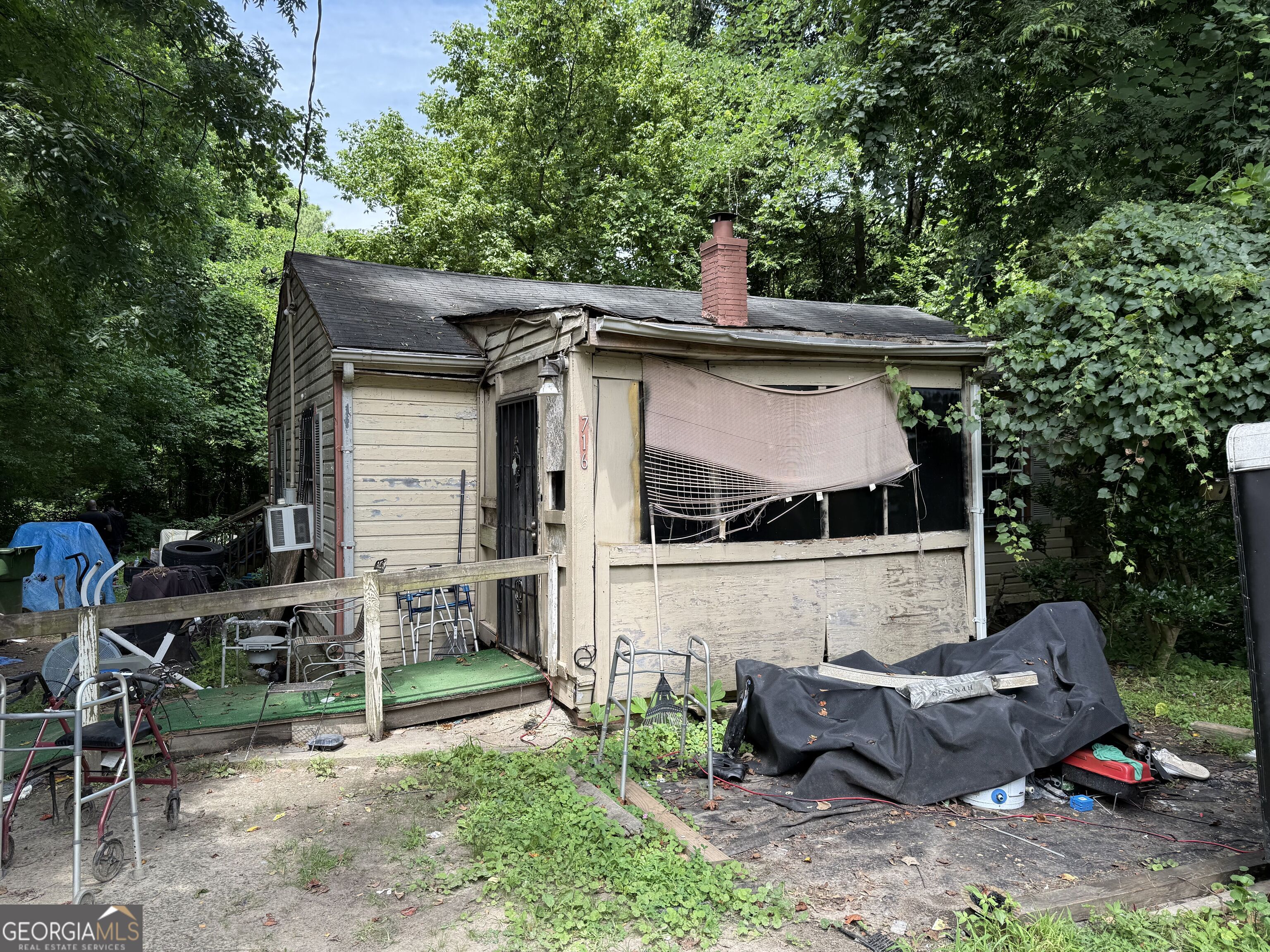Land with a house, but fire damage will most likely make this a tear down. Sitting on a level .293 acres. Great investment property to build a home for resell or immediate move-in.