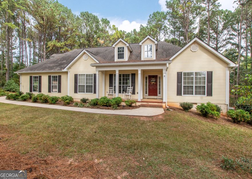 This 2,053 +/- sq ft home has a country feel on 2 private acres yet is convenient to Sam's Club/Costco (11.3 miles), Newnan & Peachtree City.  You will love the covered front porch...a great place to watch the sunsets! The Dining Room and Family Room are nice size, the Family Room has a vaulted ceiling and stone fireplace. The large Kitchen & Breakfast Area has a coffee bar and desk area and the Pantry is located in the spacious laundry room off the kitchen. The dishwasher was replaced 3 yrs ago. The Primary Suite is spacious and the Primary Bath has double vanities, garden tub, separate shower and walk-in closet. The secondary bedrooms are nice size with double closets. Upstairs you will find a large Bonus Room with access to the attic. There is a 12 x 12 Storage Building and additional parking area for RV/Boat/Guests. The backyard is fenced and the red chicken coop can stay with the property. The crawlspace is head height and has abundant space. The house has been recently pressure washed and the septic tank was pumped in 2025.
