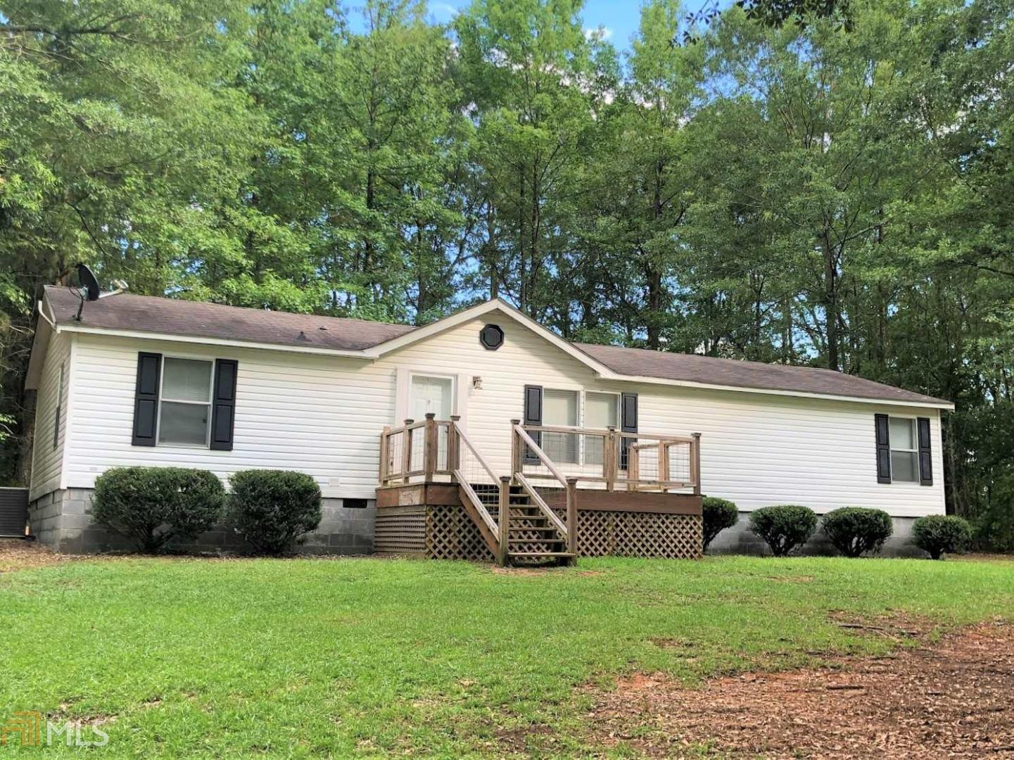 Gorgeous setting with shade trees surrounding home - large kitchen w/ island and plenty of cabinets, 3 Brs, huge master with walk in closet and office space, front and back porches & includes new HVAC. Move in ready, nice neighborhood, Call today for all the details!
