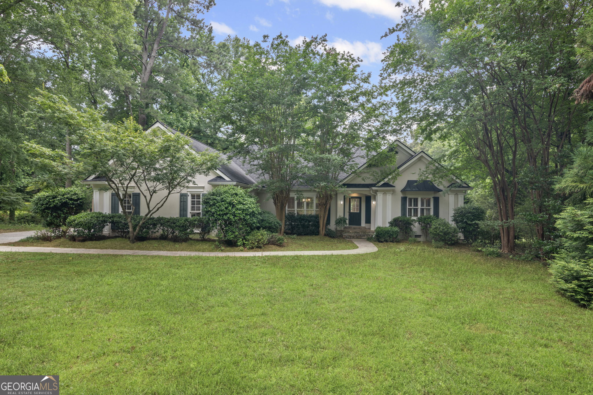 BEAUTIFUL SETTING ON THE WATER IN LAKE REDWINE! Custom ranch home with hardwood floors, new carpet, fresh paint and fresh landscaping. Foyer entrance. Large living room with high ceilings, custom crown molding, fireplace, lake views. Dining area. Kitchen has breakfast area with bay windows, breakfast bar. Large, screened porch off living room with deck access and lake views. Split bedroom. Spacious primary bedroom with lake views and deck access, his/her walk-in closets, primary bath has garden tub, separate shower, double vanity, tiled floor. Nice secondary bedrooms that share the second bath. Half bath off laundry room off garage. Two car garage. Private dock on the water. Walk-in crawl space. Enjoy all the amenities of Lake Redwine - lake, marina, pool, clubhouse, tennis and pickleball courts.