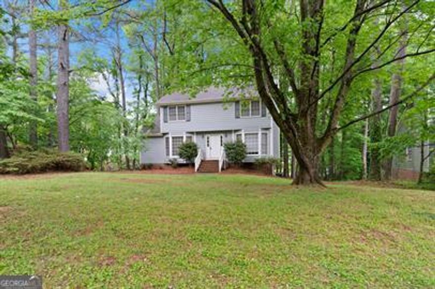 Charming 3 bedroom 2.5 bath home in sought after Marietta GA. Throughout the home you will be greeted with soft carpeting, shiny hardwood floors, a cozy fireplace, eat in kitchen, large backyard deck, as well as spacious living areas. The home also houses an unfinished basement. The home is close to Historic Marietta Square as well as so much more