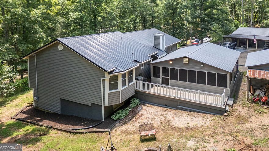 County living close to the city! 5 acres in Cherokee County! New metal roof, new windows, new insulated siding that comes with a lifetime guarantee, and a 3 yr old tankless water heater. This ranch on a finished basement will not disappoint with a big kitchen, new flooring, and ample cabinet space. Entertain family and friends on a newly screened-in porch with tongue and groove ceilings and a 12x24 deck. The pole barn sits on a 50x30 concrete slab with a 15x50 covered concrete porch and 50 ft lean-to attached. This is perfect for a mother-in-law suite, holidays, or just hanging out. It has a second kitchen, bar, half bathroom, and a 2 gallon water heater. Check out the 20x26 detached garage with 12 ft ceilings, a 20x20 workshop, and 24x24 carport. No HOA and plenty of space to park your boats, trailers, or any other toys you have. This well taken care of home has only been loved by one family. Come out to see the home that makes you feel like you are in the country, but you're really only 7-10 miles from shopping and restaurants.