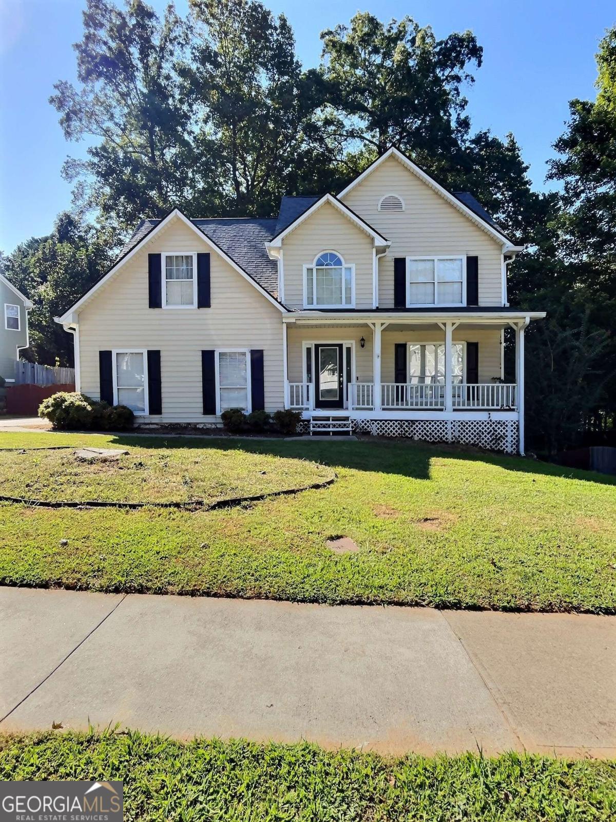 Welcome to your new home in Collins Hill School District. This home combines space, comfort and flexibility. Whether you need room for family, entertaining, or extended family living, the terrace level suite adds a lot of value and versatility. The finishes and recent updates make it easy to just unpack-ready to move into! Home features a two-story foyer, hardwood and tile floors on main. Large kitchen with plenty of counter space and spacious cabinets. Separate dining room open to a front formal/office/flex room. A cozy fireplace in a spacious family room. Walk outside into the screened in porch overlooking a private fenced backyard. Huge master bedroom with sitting room with his/hers walk in closets. Finished terrace level with hardwood floors and in-law/teen suite with kitchen and 5th bedroom with full bathroom. The neighborhood offers both tranquility and convenience: close to shopping, highways and everything Lawrenceville has to offer! This one won't last long!
