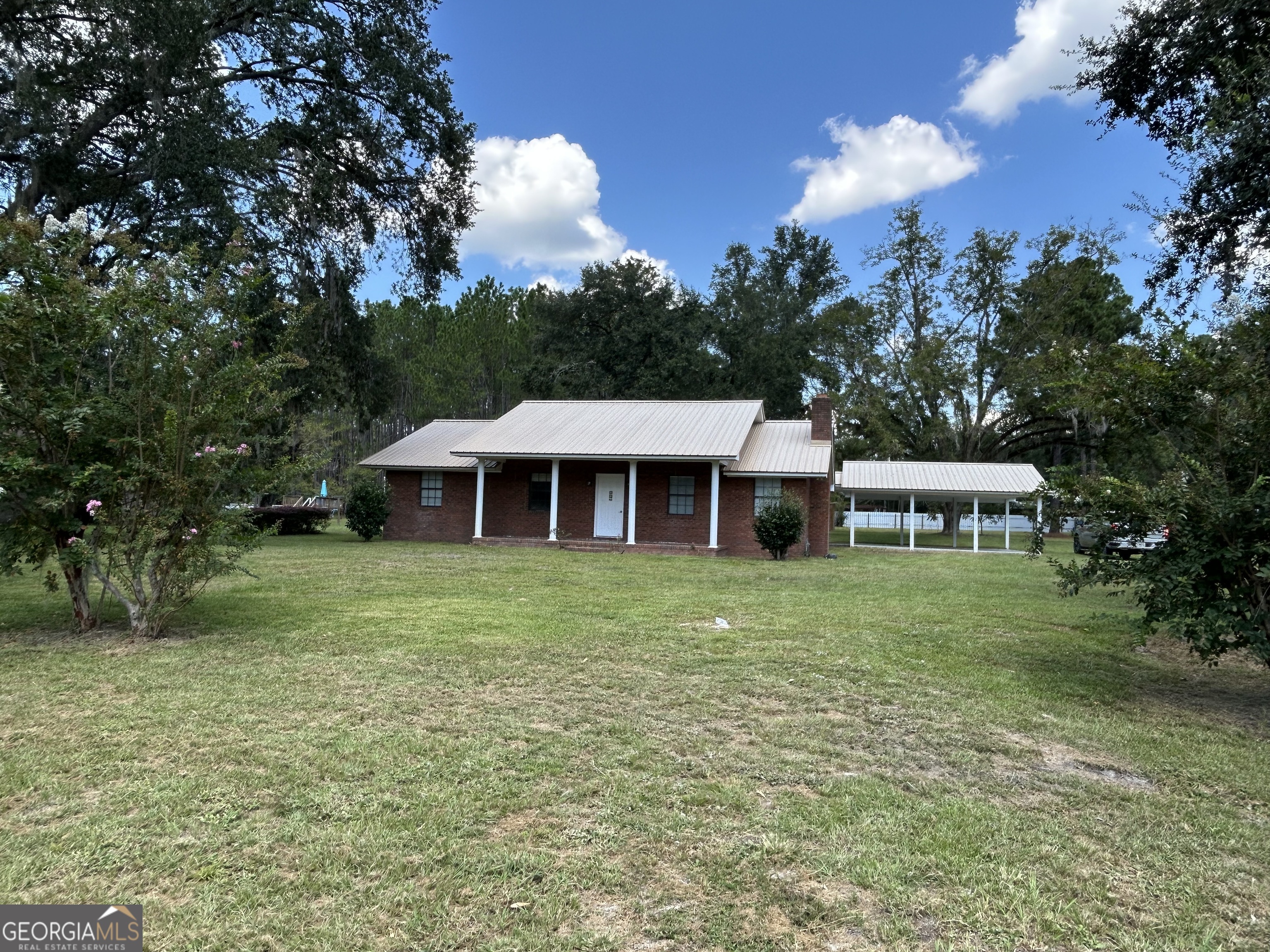 Looking for a home with peace, privacy, and a touch of nature? This 1888 sq. ft. beautifully remodeled 3 bedroom, 2 bath home sits on .86 of an acre and is located in a country setting just 3 miles from the great Altamaha River-ideal for fishing, boating, public boat ramps and perfect for a weekend getaway. When you step inside this home you will find a large living room with a wood burning fireplace perfect for those winter nights, an updated kitchen with stainless steel appliances, plenty of gorgeous cabinetry, and lots of solid surface counter space for cooking and gathering and a separate dining room. Upgrades include a new deep well, HVAC system, new paint, laminate flooring, bathroom fixtures and ceiling fans. Whether you're starting your first home or looking to escape city life, this move in ready home offers the perfect mix of charm, value, and location. Don't miss this one. It is priced right and the perfect location. This won't last long so call for a showing quickly.