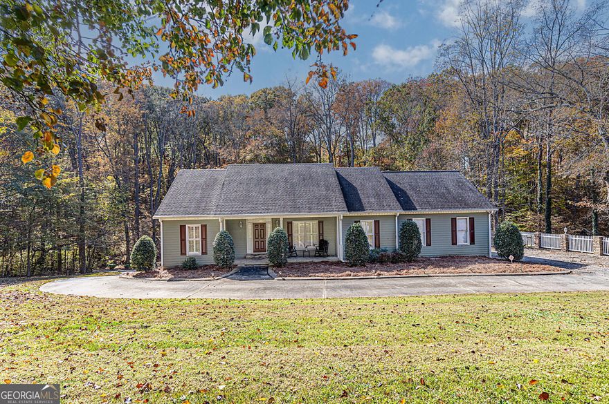 Spacious 4-Bedroom Home with Finished Basement on 1.64 Acres in Kennesaw, GA!    This beautifully updated 4-bedroom, 3-bath home offers over 3,100 sq ft of living space, a finished basement, and two separate garages - all nestled on a private, partially wooded 1.64-acre lot in Kennesaw, GA.    Freshly painted throughout, the interior features hardwood floors across the main level and a bright, open layout. The eat-in kitchen includes recessed lighting, new countertops, a large island, ample cabinet space, and a pantry. Just off the kitchen, a dedicated laundry room offers extra space with its own utility sink.    The vaulted-ceiling family room is filled with natural light from oversized windows and features a fireplace that can be used with wood or gas. Step out onto the deck, accessible from both the kitchen, family room and master bedroom, perfect for outdoor dining or relaxing.    A formal dining room adds elegance for entertaining. The master suite sits on one side of the home, separate from the two additional main-level bedrooms, offering privacy. The en-suite bath includes double vanities, a garden tub, a separate shower, and a private water closet.    Downstairs, the 1,045 sq ft finished basement expands your options with a full entertainment room, second kitchen with new countertops, an additional bedroom, and multiple storage areas.    Car lovers and hobbyists will appreciate the two garages: a traditional 2-car garage on the main level and a 2-car tandem garage on the lower level.    This move-in-ready home offers space, flexibility, and comfort - inside and out.