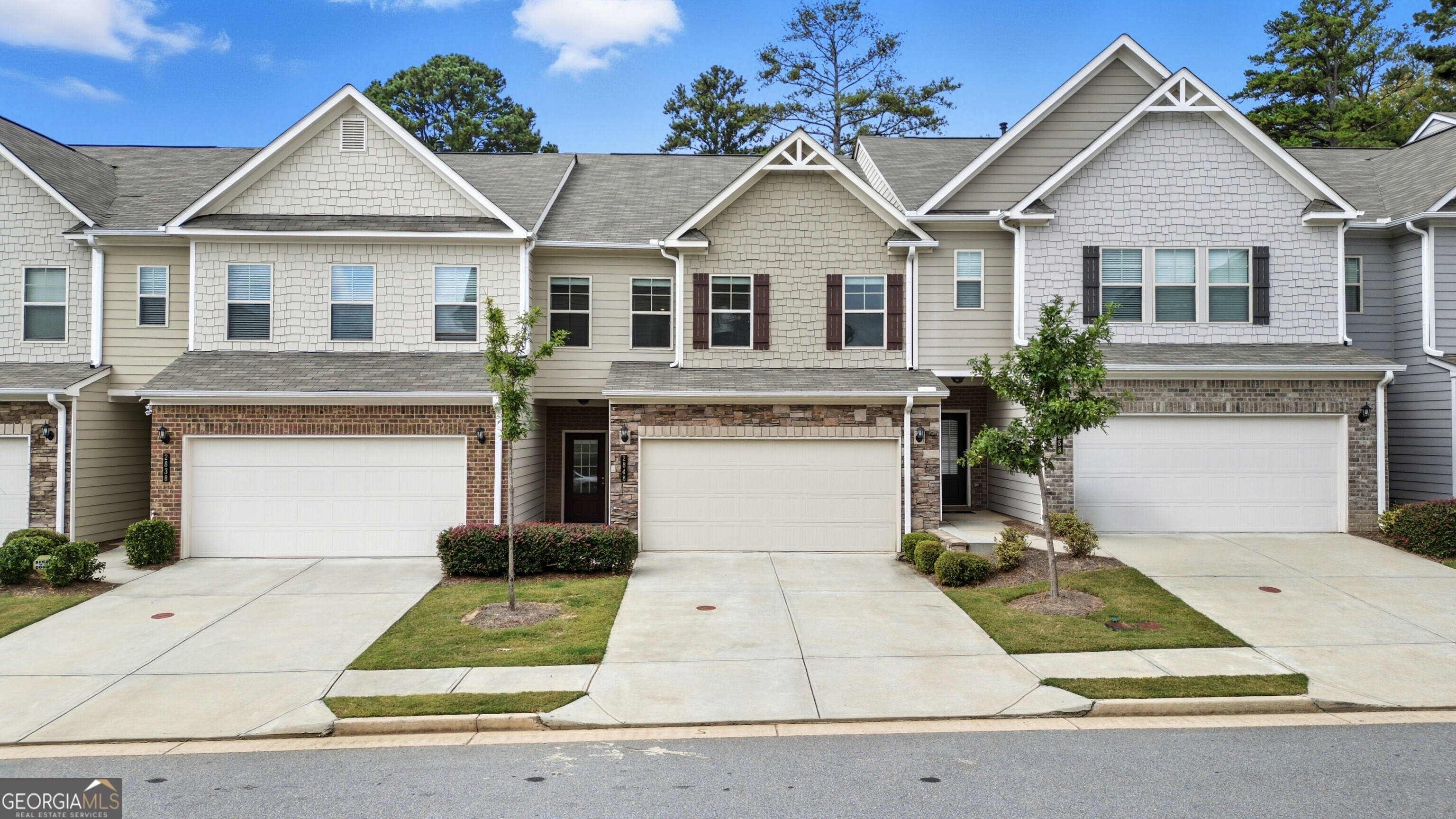 Welcome to this beautiful move-in-ready, like-new 4-Bedroom, 2.5 Bath Townhome. The open floor plan features a spacious Chef's Kitchen with a large island perfect for entertaining and meal preparation, upgraded cabinetry, and all stainless-steel appliances. The Dining Area flows seamlessly to the Family Room and the inviting Patio. Upstairs, retreat to the stunning Primary Suite, featuring a tray ceiling, an expansive walk-in closet, and a luxurious en-suite Bathroom with dual vanities, a shower, and a separate soaking tub. The second level also features three additional Guest Bedrooms, a Guest Bathroom, and a Laundry Room equipped with an HE Washer & Dryer. The spacious Garage includes a level 2 Tesla charger and additional shelving for storage. Relax outside on the patio and enjoy the fully fenced yard, featuring a newly sodded backyard, perfect for your furry babies. Conveniently located just off Buford Highway and only minutes from both Downtown Norcross and Downtown Duluth, and easily accessible to PIB & I-85. The Home has been thoroughly pre-inspected by Sure Thing Home Inspections, appraised by D.S. Murphy, and the Home is backed by a comprehensive 2-10 Supreme Home Warranty, offering added confidence and peace of mind.