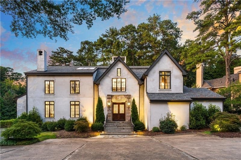 Rare opportunity in one of Atlanta's most desirable estate neighborhoods in zip 30327. Situated on 1.5 acres, with a new/private tennis, pool, spa outdoor fireplace and grill. Private, gated and nestled in the trees. Perfect for entertaining with patios that wrap around an outdoor kitchen, fireplace, tennis courts, basketball and gorgeous redone pool and spa. Design sensitive redesign of interiors/exterior throughout. Hard coat stucco. Transitional, open with soaring ceilings and walls of glass with views of the pool. Living room and study upstairs overlook the pool. Honed marble in the kitchen and breakfast room filled with natural light and overlooking the pool and tennis court. Plenty of property behind the pool as well! Keeping room with fireplace is open to the kitchen creating an informal living, dining and entertaining environment. Large dining room that is open to the 2 story living room with a wall of glass, overlooks the pool and and grounds. Upstairs is a private owners suite with custom closet systems and spa bath. Hardwood floors throughout and freshly painted interiors with a perfect neutral palette ready for the next owners! Very large room and bath on third floor for cozy evenings and a movie, studio or kids playroom. Gym, additional bedroom and entertaining area downstairs at the pool. Terrific location in highly desirable area that is close to Chastain Park and near the best private schools and shopping in Atlanta.