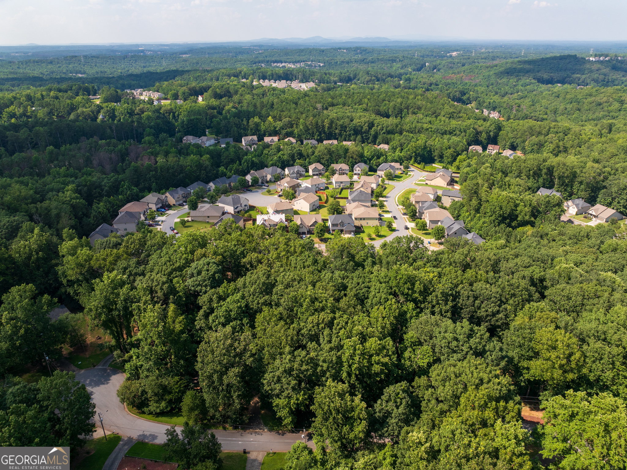 This 0.81-acre lot on Park Lane offers the best of both worlds: small-town comfort with easy access to city life. Set in one of Dallas, Georgia's warm and welcoming neighborhoods, the property is just minutes from Highway 92 and less than an hour from downtown Atlanta. That means you can enjoy concerts, pro sports, or commute to work in the city, then return home to a quieter setting. Dallas is known for its historic square and the Silver Comet Trail, giving you plenty to explore. The lot itself is well laid out, with a flatter area in front for a driveway or yard and a gentle slope that's great for a walkout basement, multi-level design, or a deck with wooded views. Zoned R2 for residential use, it's ready for you to build or hold as a future investment in the growing community. With a balance of privacy and convenience, this property makes it easy to picture your next home.