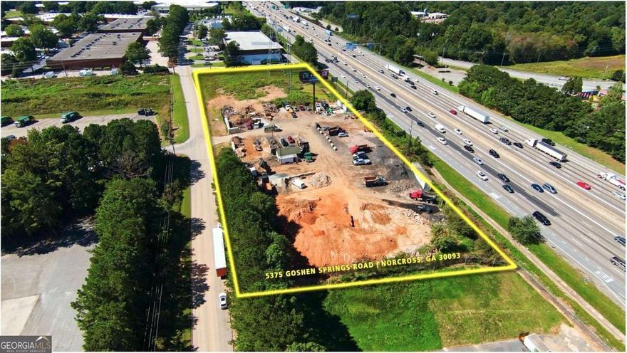 Prime Commercial LOT (including 2 parcels) on Interstate 85N frontage Road. Lot is located between Indian Trail & Jimmy Carter. Over 280,000 traffic counts a day. Prime location with high visibility from one of the populous county in GA. Currently zoned M1. Level lot with public utilities. Why pay for billboard when you can put a sign on your own building! Call for more information!