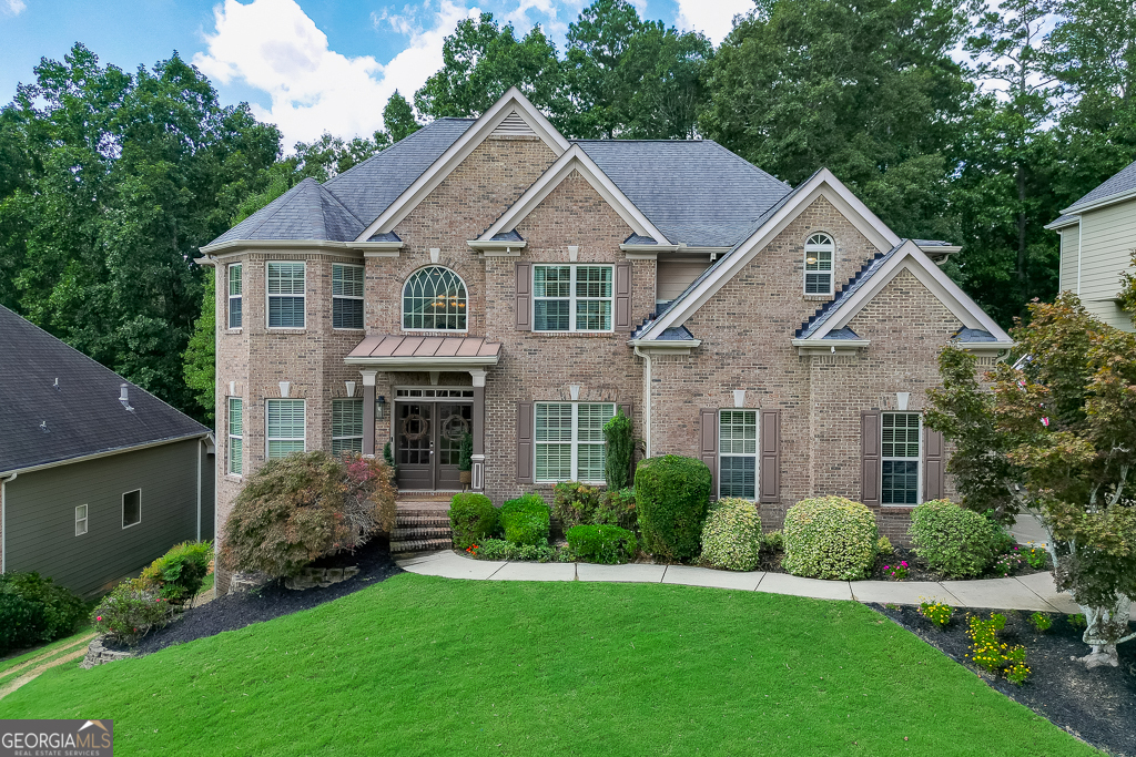 Welcome to your dream home in the highly sought-after Seckinger High School district, Gwinnett County's premier new AI-focused academy! This stunning residence offers two master suites, a finished basement, and a gorgeous open kitchen featuring a brand-new gas range. The newly remodeled master bathroom is a true retreat with dual shower heads and a luxurious 71" freestanding soaking tub. Enjoy natural light streaming through tons of windows that give the home a grand, open feel. Step outside to your backyard oasis with a brand-new jacuzzi, firepit area, and serene wooded views. The neighborhood is equally impressive, offering a community pool and welcoming atmosphere. With space to entertain, modern upgrades throughout, and unbeatable school district placement, this home checks every box.