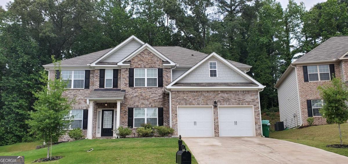 Welcome to this stunning 5-bedroom, 4-bathroom brick-front beauty nestled in a quiet community just 20 minutes from Downtown Atlanta and 30 minutes from Hartsfield-Jackson Airport. This move-in ready home offers an abundance of space, style, and convenience - perfect for modern living. Step inside to find a bright and airy floor plan featuring a bedroom and full bath on the main level, ideal for guests or multi-generational living. The chef's kitchen is a culinary dream, boasting ample counter space, premium appliances, and a seamless flow into the living and dining areas. Retreat upstairs to the oversized owner's suite, complete with his and hers walk-in closets, a spa-like en-suite bath with separate tub and shower, and plenty of room to relax and unwind. Enjoy outdoor living in the privacy-fenced backyard, featuring a brand new storage shed-perfect for tools, hobbies, or extra storage. Located just minutes from shopping, schools, and interstates I-20, I-285, and I-675, this home offers unparalleled access to everything you need. ? Additional Features: 5 Bedrooms 4 Full Bathrooms His & Hers Closets in Owner's Suite Bedroom & Full Bath on Main Level New Storage Shed Chef's Kitchen Privacy Fenced Backyard Close to Major Interstates, Schools & Shopping Don't miss your chance to call this exceptional property home - schedule your private showing today!