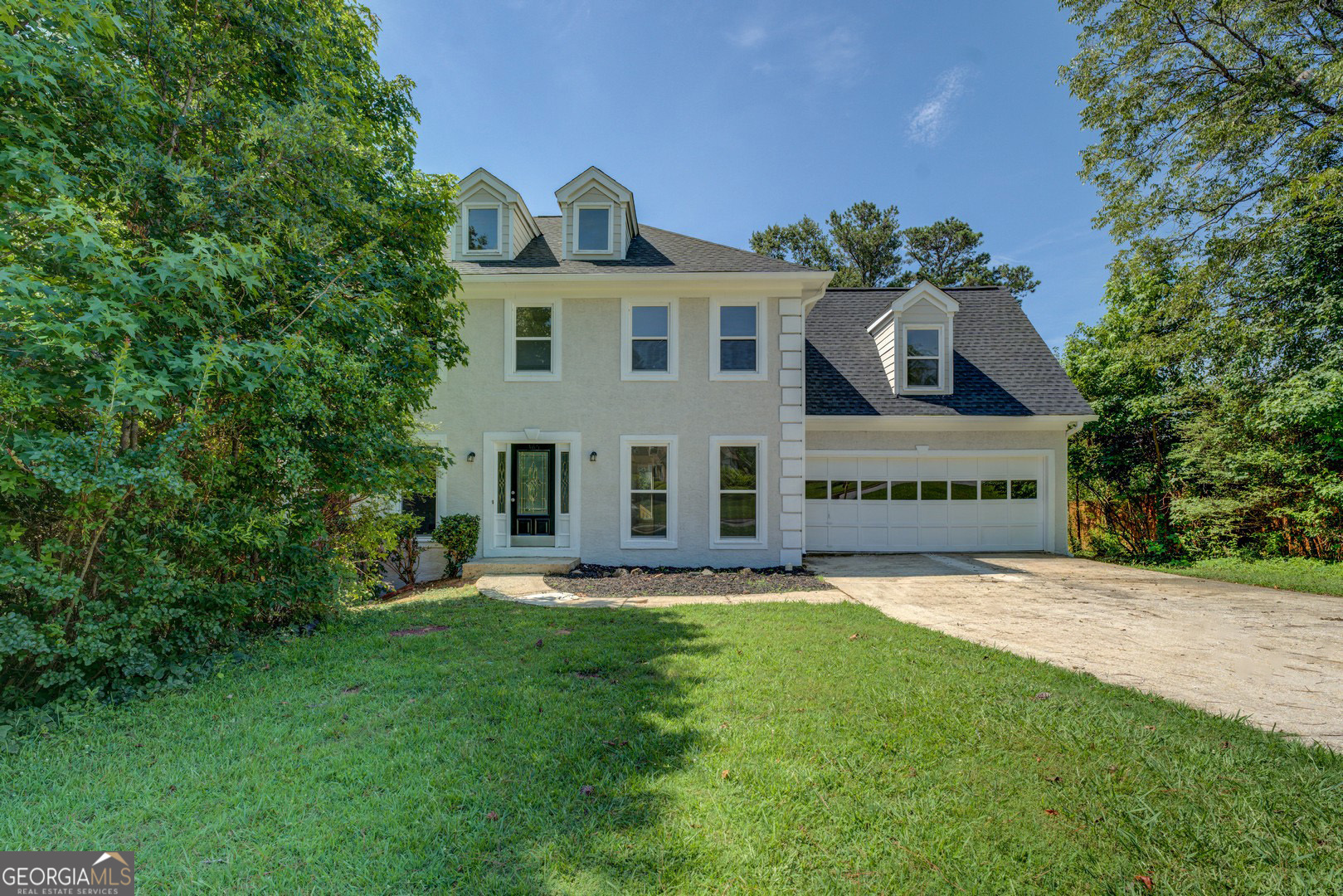 Spacious 2-story home with 4 bedrooms and 2 baths upstairs, a half bath on the main. Master suite has a sep. tiled shower with glass block walls, double vanity, sep tub. The 4th bedroom is larger and opens to the hall bath. Formal Living and Dining rooms, updated kitchen with granite, breakfast area, and overlooking the deck with a look at the large private backyard. The family room has a fireplace and opens to the new deck. The lower level has 2 finished rooms to be used as you wish. There is a large, unf room that is a great space for the mechanicals. There is a 2-car garage. The interior has new flooring and fresh paint. The deck is new. The community has a NON-mandatory hoa, but the community has a pool, golf course, tennis and clubhouse. This one won't last - hurry on and call for your showing.