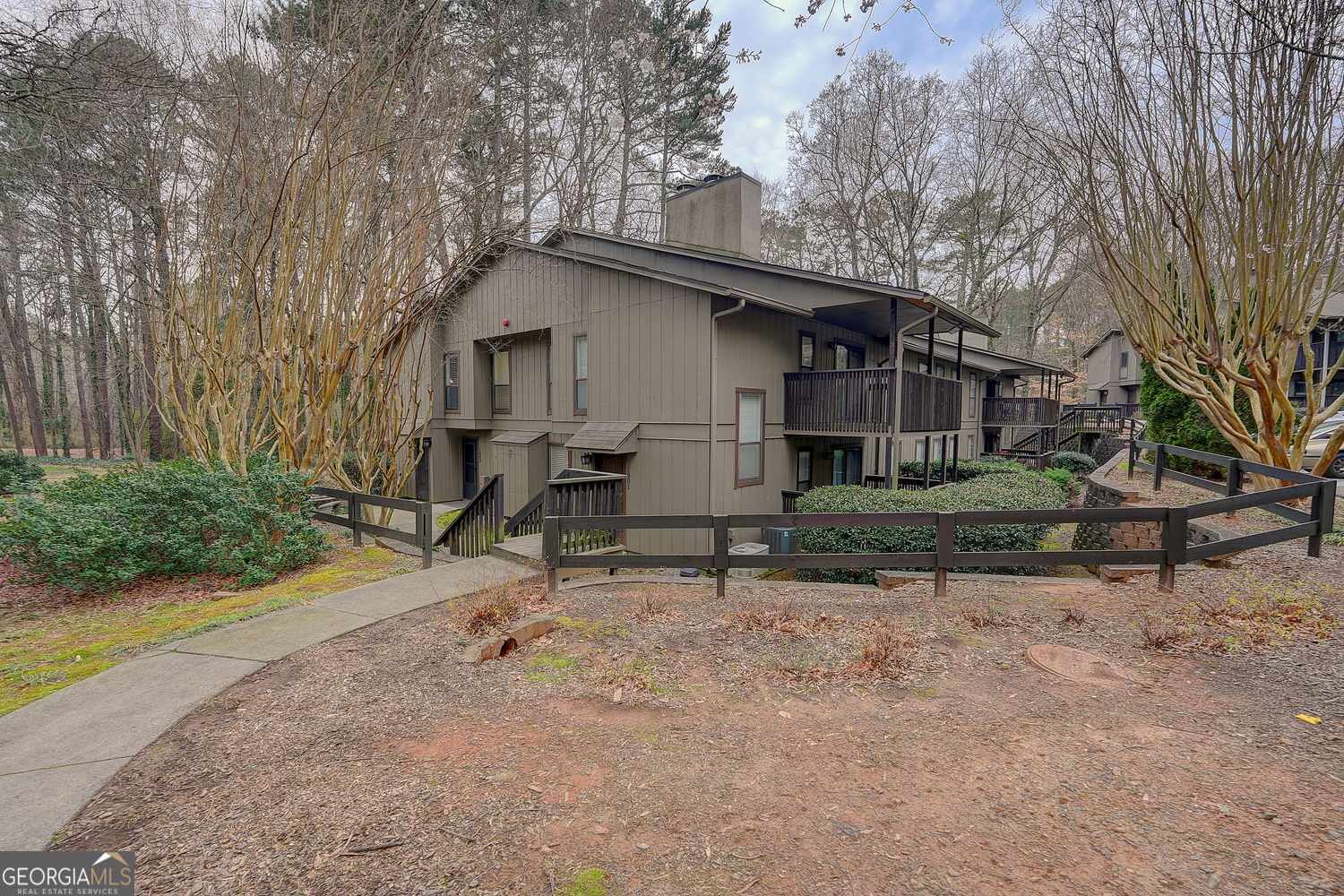 Amazing location! Nestled in this serene hideaway right in the middle of all the action especially with The Battery and Truist Park being minutes away! The wooded view from the balcony is a refreshing green backdrop to a quiet, yet active community. Two dog parks, two swimming pools, tennis and pickleball courts situated in a beautifully landscaped complex. This well maintained end unit features a wonderful open floorplan. Family room with fireplace with doors out to a large deck overlooking the woods, master with walk in closet plus an additional closet, extra windows for a lot of natural sunlight, updated bathroom, walk in shower, toilet with remote control bidet seat, newer washer and dryer, large television in family room also included. This is truly a one of a kind end unit that exudes privacy in the heart of Smyrna, yet close to shopping, entertainment, I-285 and I-75!