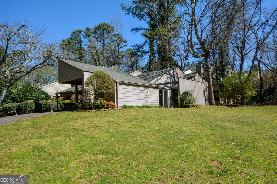 Cozy One-Level 3BR/2BA Condo with Screened Porch, Two Living Areas & Wooded View   This cozy and well-maintained one-level condo offers the perfect blend of comfort, convenience, and extra space. Featuring 3 bedrooms and 2 full baths, it includes both a great room and a separate family room-ideal for relaxing, entertaining, or setting up a home office or hobby area. Step out onto the screened porch and enjoy your morning coffee with views of a peaceful wooded area-your own quiet retreat, just steps from the community pool. The primary suite is spacious and private, and the two additional bedrooms offer generous closet space and flexibility for guests or family. The kitchen comes fully equipped, and the washer and dryer remain with the home. A newer roof and a brand-new AC compressor offer added peace of mind. All of this is tucked away on a quiet street, yet just minutes from GA-400, shopping, restaurants, and everything you need for easy daily living.
