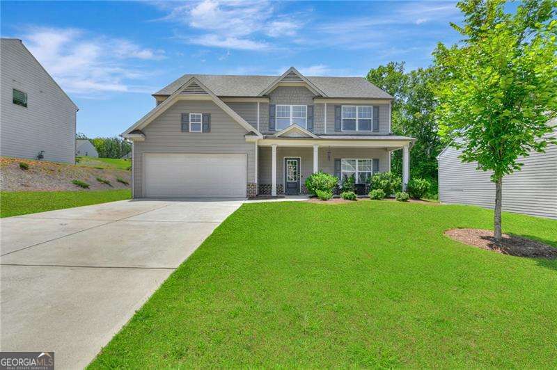 Price improvement on this beautiful home. Welcome home to this beautiful 4 BR/2.5 BA home located in a swim community. This home features a beautiful 2 story Foyer with open staircase, Powder Room, a Formal Dining Room that easily will seat 12+, a Family Room or possible Office area, huge oversized Great Room with fireplace currently being used as a game room, open kitchen concept with large island, lots of white cabinets, solid surface countertops, breakfast area, hardwood flooring on the main. On the second floor you will find 3 spacious spare bedrooms, the laundry room, oversized master suite with a large master bath with tile shower, double vanity and ceramic tile flooring. This home sits on a flat, professionally landscaped lot.