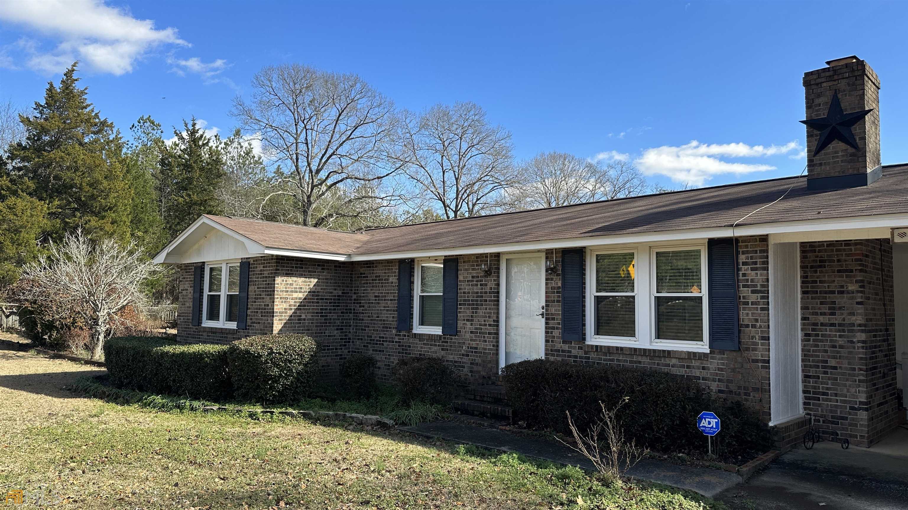 Wow! The possibilities are endless with this move in ready brick home with new roof and Trane HVAC on 1.96 acres!Very well maintained with double pain Vynil windows and new Roof and HVAC replaced in 2022. Lot is huge and has multiple fenced areas and storage buildings including a large garage shop that looks like a matching smaller home behind the main. Shop has electricity and air conditioning with roll up garage door with plenty of room for that project. Attached car port but multiple places to park boats, ATV's, motorcycles. Property is just beautiful in spring with all the booming flowers including Lillies, azaleas, roses, dogwood and plum trees, scuppernongs and more. Just 4 miles from Jeffersonville, you can really get away from it all at the quite but convenient property. Home is priced to sell so call today for your private tour.