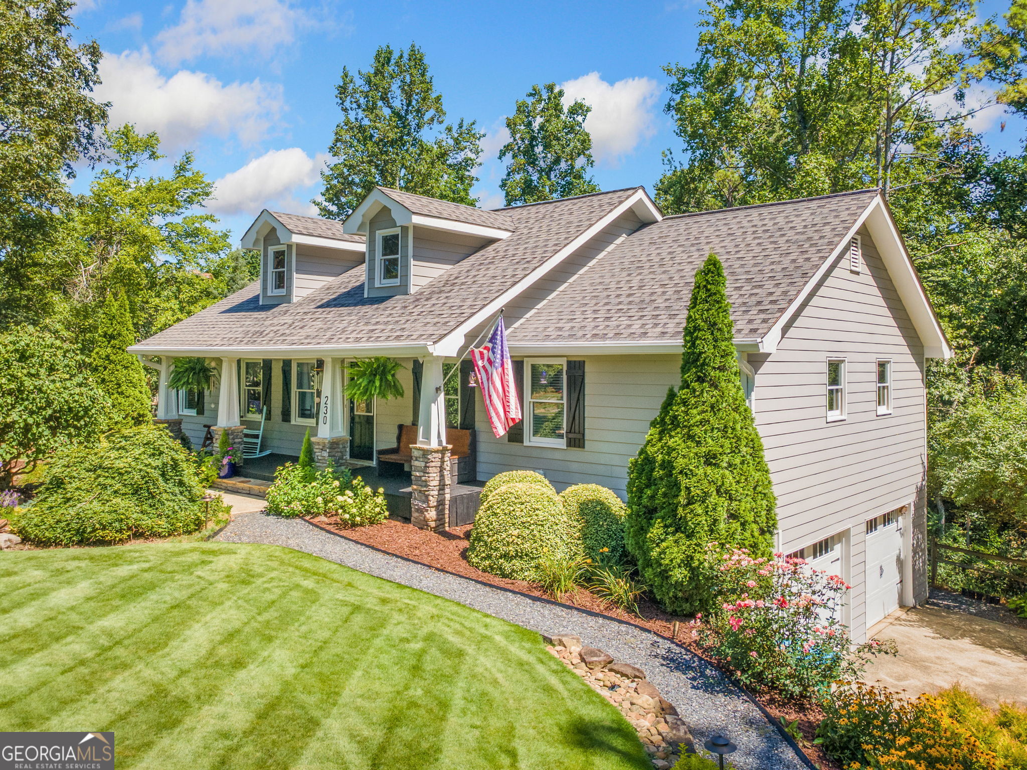 The Mini-Farm You've Been Waiting For! Welcome to this charming ranch-style retreat nestled on 2.18 acres of professionally landscaped land. From the moment you arrive, the stunning landscaping sets the tone-meticulously maintained and truly magazine-worthy. Thoughtfully designed for both comfort and functionality, this mini-farm features a full sprinkler system, two lush gardens, fruit bushes, a chicken coop, and a beautiful fire-pit area-perfect for peaceful evenings outdoors. Step inside to discover a comfortable and inviting flow, with the primary suite conveniently located on the main level. The home boasts beautifully updated bathrooms and a walk-in laundry room for added ease. The bright kitchen opens onto a brand-new back deck-ideal for morning coffee, weekend grilling, or entertaining guests. The main level offers three bedrooms and two full updated bathrooms, while the finished basement includes an additional bedroom, full bathroom, and a flexible space perfect for a media room, home office, or secondary living area. You'll also enjoy access to the spacious two-car garage with plenty of storage. Additional highlights include two outdoor storage sheds, a fenced-in side yard perfect for pets, and ample parking for guests. Located on a quiet and private drive, this home provides the peace of country living while being just 10 minutes from Highway 575-offering easy access to shopping, dining, and commuter routes. Whether you're looking for a peaceful homestead, a hobby farm, or simply more space to breathe, this property has it all. Don't miss your chance-schedule a showing today!