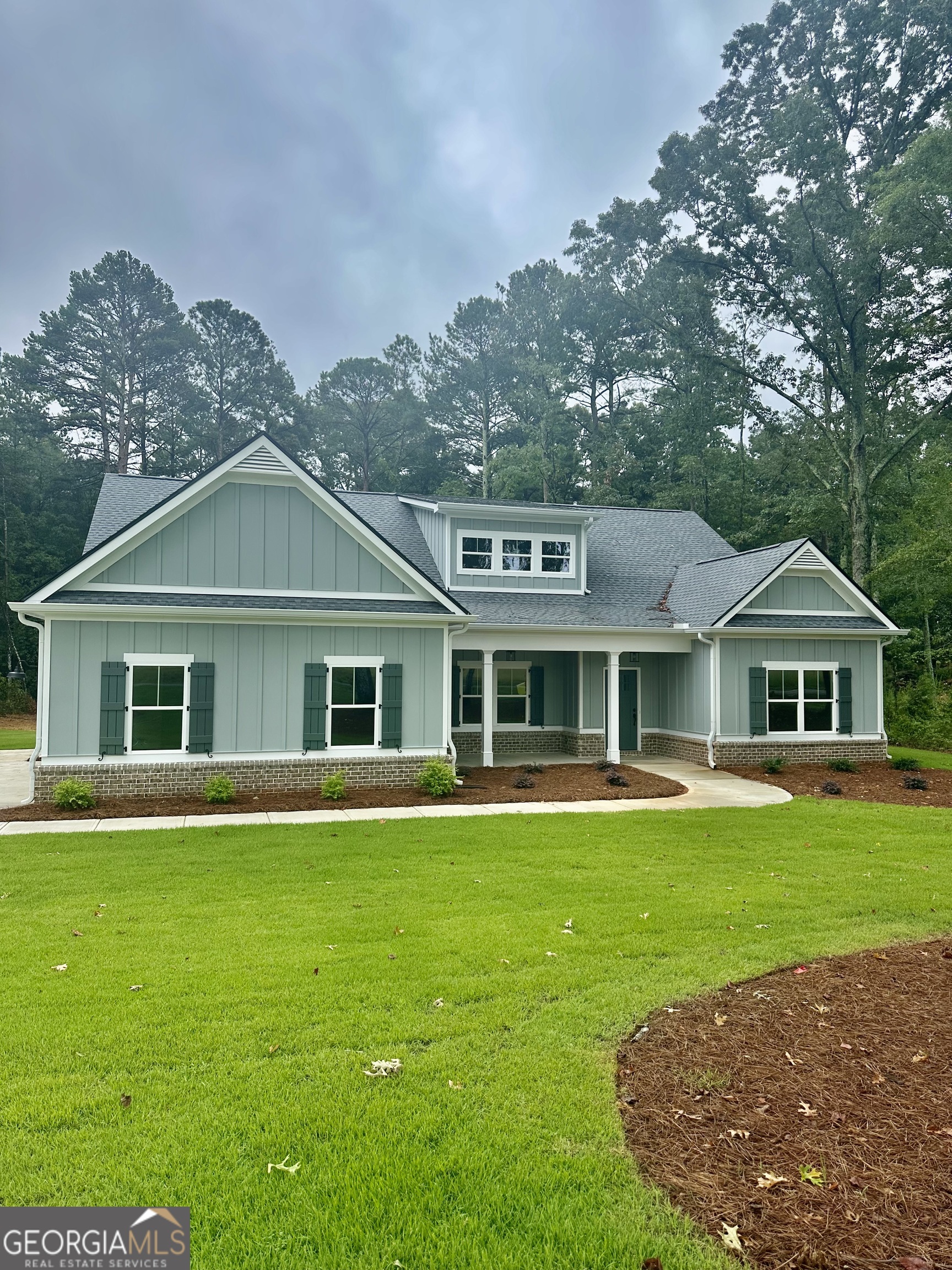 Stunning New Construction on 2 Acres - No HOA - Gratis Area This beautifully crafted 4-bedroom, 3.5-bath custom home by Country and Design Custom Homes blends timeless Craftsman style with modern comfort. Set on a private 2-acre lot with no HOA, this home offers space, freedom, and style. Inside, enjoy a spacious open floor plan with LVP flooring throughout, custom shiplap accents, a large foyer, and a formal dining room. The split bedroom layout ensures privacy, while the chef's kitchen features granite countertops and upgraded appliances. A covered back patio extends the living space-ideal for relaxing or entertaining. Located in the highly desirable Gratis community, this property offers upscale living!