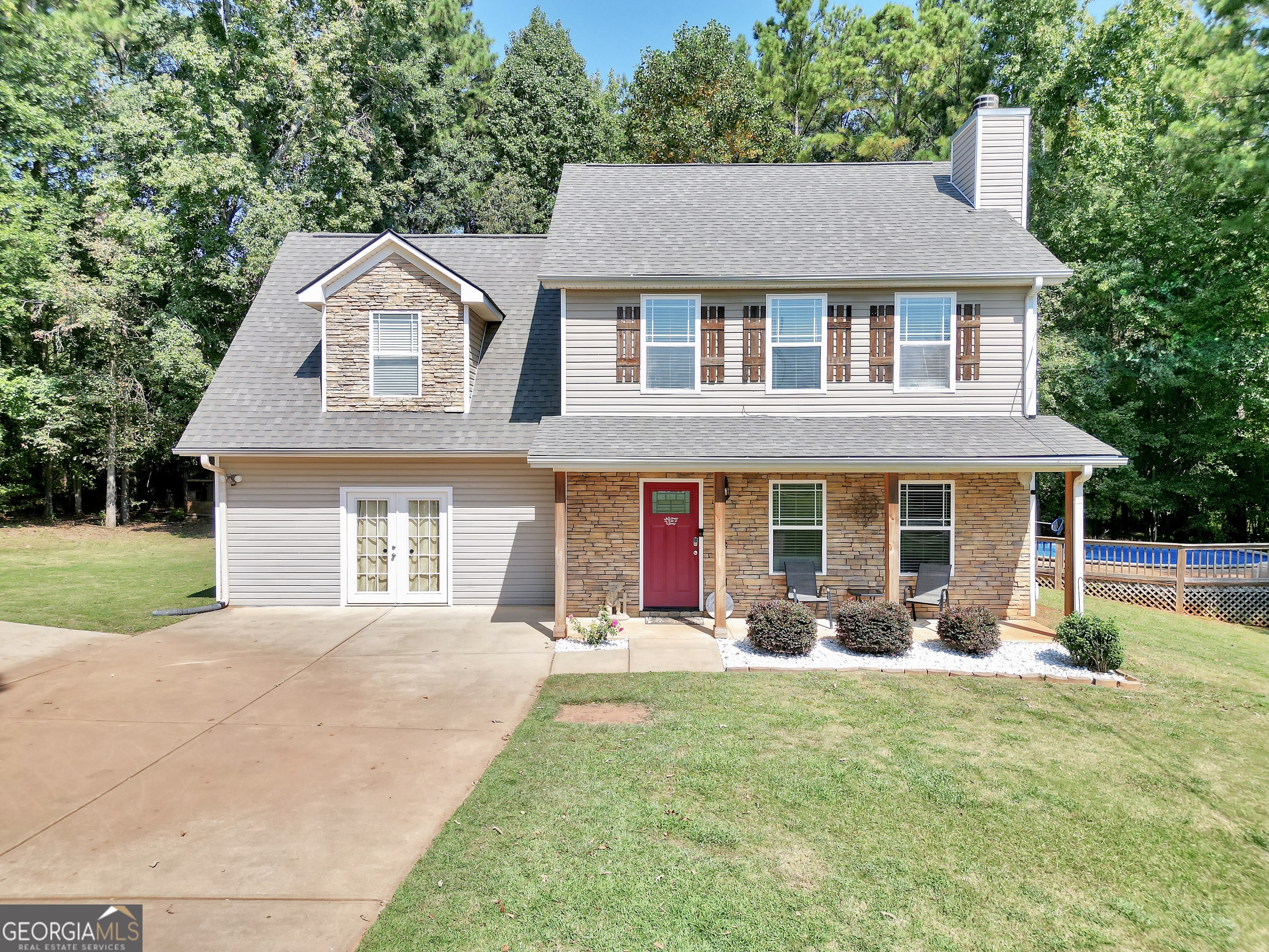 Welcome to 133 Potomac Dr! A Private Retreat in the Sought-After Ola School District! Tucked away in a quiet cul-de-sac on a generous 1-acre lot, this spacious 4-bedroom, 2.5-bath home offers the perfect blend of comfort, functionality, and outdoor enjoyment. Step inside to 2,300 sq ft of well-designed living space featuring hardwood floors throughout. The main level includes a welcoming living area with fireplace, a kitchen with island, pantry, refrigerator, and oven - perfect for hosting or everyday living. A convenient half bath is located downstairs, along with a converted garage that now serves as a versatile bonus room, complete with a newly added stand-up shower and sink, ideal for a guest suite, office, or playroom. Upstairs, you'll find all four bedrooms, including a spacious master suite with two walk-in closets, a separate soaking tub and shower, and a linen closet for added storage. Two additional bathrooms serve the remaining bedrooms, providing ample space for family or guests. Step outside to enjoy your private backyard oasis featuring a large covered patio with ceiling fans - perfect for relaxing or entertaining, and easy access to the above-ground pool with a surrounding deck. Whether you're enjoying a summer swim or a quiet evening outdoors, this space is made for year-round enjoyment. Additional perks include a detached garage with electricity, great for a workshop or storage - and a chicken coop for those looking to enjoy a bit of country living. This home offers the perfect combination of space, privacy, and convenience. Don't miss your chance to make this move-in-ready home your own! Schedule your private showing today!
