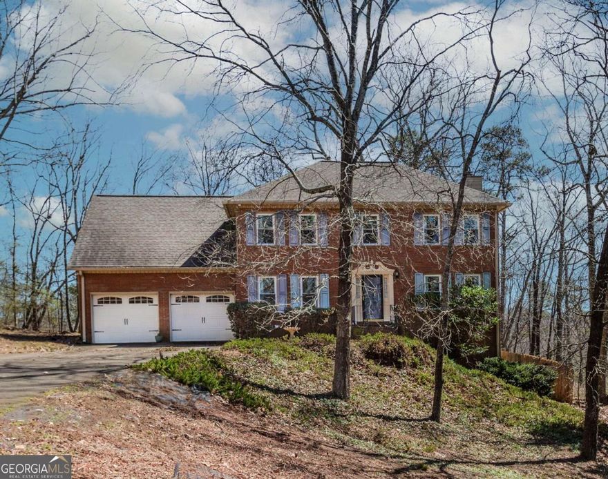 Welcome to this beautifully maintained 6 bed / 3.5 bath home in East Cobb's Woodstream/Blackjack Hills neighborhood. Nestled on a super quiet large lot, enter into dining that seats more than 12 and a formal living to the left and right. Pass thru to the cozy family room with a painted brick fireplace and onto the spacious kitchen which offers granite countertops and loads of cabinet space.  Just beyond the kitchen is the walk in laundry room and access to the garage.  A  bath is located between the kitchen and family room. Step outside to the relaxing screened porch which overlooks the serene backyard, seriously so much room for a pool, it feels like the backyard goes on forever.  Upstairs, the oversized retreat-style primary suite with double closets, two-bathroom vanities, a whirlpool tub, and a separate shower. Next up generously sized secondary bedrooms are also upstairs and a huge bonus room perfect for a media room or additional bedroom. You will find plenty of hall closet space and a second full bathroom. The basement level offers a finished den area that is perfect for a rec room, a small kitchenette, a full bath and two additional bedrooms.  The basement also has a private fenced lawn area and this area is perfect for a in law suite or additional rental income since it has a separate entrance both inside and out. This home has many closets, pantry space and you can access the screened in back porch from both the eating area and living room.  New carpet with super thick padding, a new water heater, new windows in 95% of the home, new ceiling fans, new lighting. electrical box and panel was replaced and new paint throughout are just a few of the upgrades since this owner purchased a few years ago. Two refrigerators staying with the home. This is an active community with optional swim/tennis! This neighborhood has an optional HOA so you can join only if you desire. Come see this East Cobb gem with many newer updates, great schools, and great location-convenient to tons of shopping, dining, parks and interstates are close by!