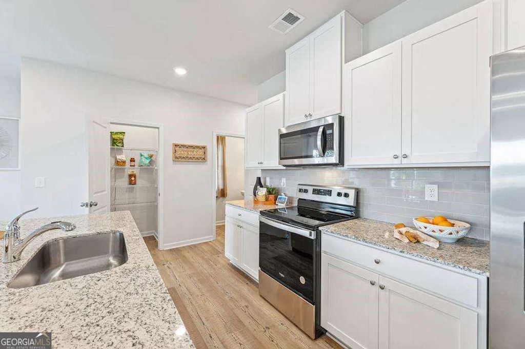 Photo of 5165 Sidney Square Drive, Flowery Branch, GA 30542 (MLS # 10640667)