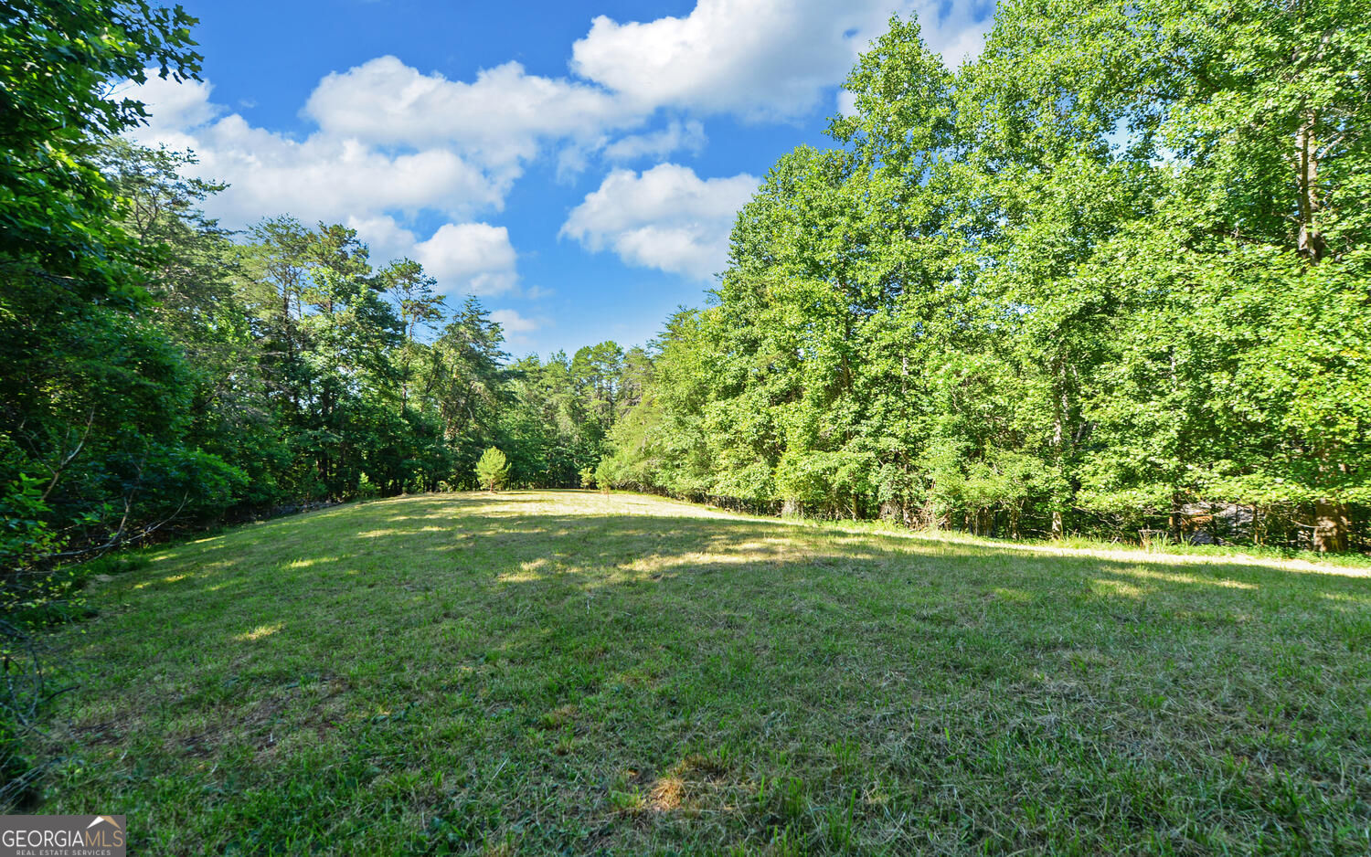 Beautiful building lot available in Sky Country! Located just 1 & 1/2 miles from downtown Dahlonega, this 2+ acre is ready for a home! Partially cleared with a beautiful open field with a lush wooded area in the rear. Wildlife is abundant in the region, including deer and turkey. The neighborhood has a voluntary HOA and has protective covenants. Located within city limits, the neighborhood is subject to city ordinances.