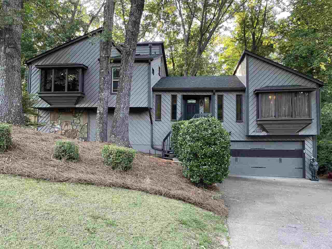 Welcome home to this charming split level with endless character! Very well maintained, newer roof, and mechanicals. Exterior just freshly painted! Most windows in the home have been replaced with double pane energy efficient windows. Kitchen has all newer stainless steel appliances that will stay with the home. Both full bathrooms have been remodeled. Several updates throughout including pallet wood walls in master and terrace level living space, barn doors on terrace level and in living room. Terrace level has a large room with attached half bath that could be made into a full bath for possible second master suite. Three bedrooms and hallway upstairs have hardwood floors as does the main floor foyer, living and dining room. Lot is over half an acre allowing for a spacious yard. Back yard has new privacy fence and several deck areas for entertaining and even a perfect spot for a hot tub! wonderful hardscape steps and walkways in front of home and along side. Extra parking pad for guests. Excellent top rated Pope High School district! East Cobb schools, shopping and dining close by! This is a wonderful, well maintained, move in ready home! ***Living room has been freshly painted 7/6/21