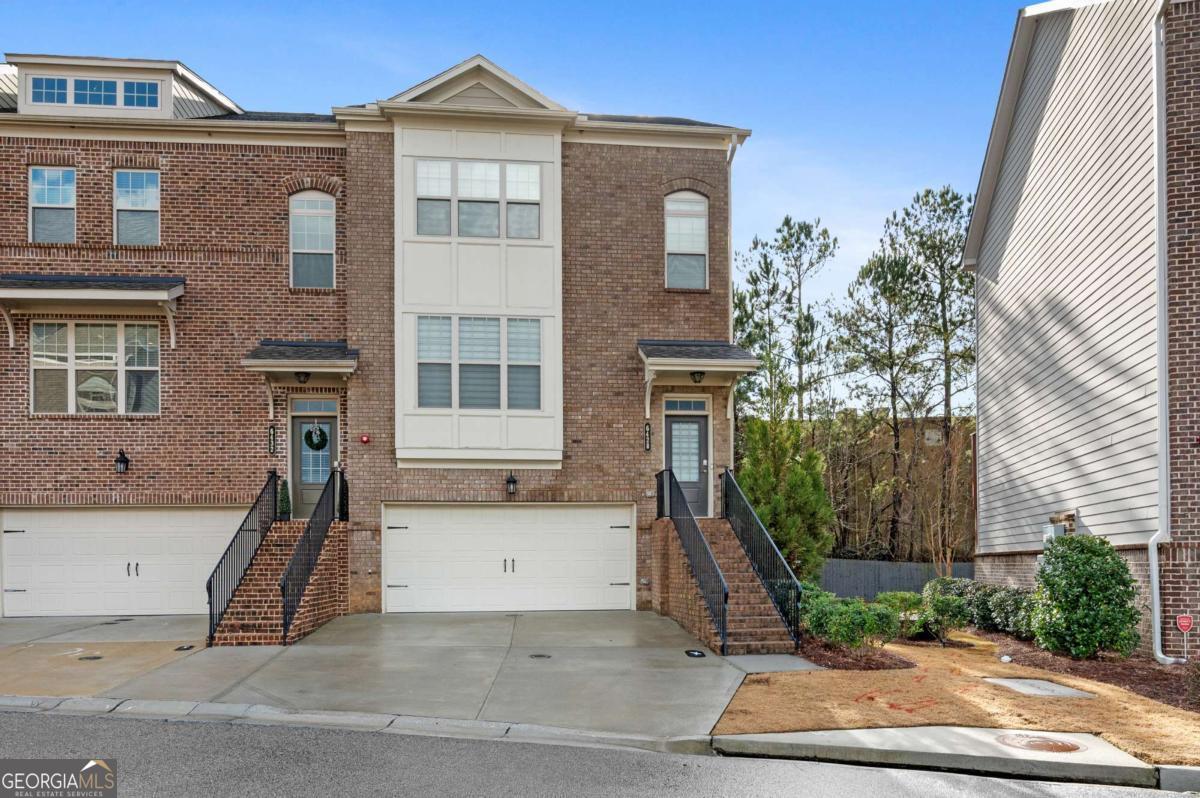 Come Make this Large End Unit townhome today! This updated/renovated townhome features a Complete Open Floor Plan w/ an Expansive Custom Kitchen w/ Island/Bar, SS Appliances, Quartz countertops, Tons of Cabinet Space & Walk- In Panty. Nice Size back,Private Patio Deck. Upstairs, you'll find the Primary bedroom and its spacious ensuite bathroom with double vanity sinks and large walk-in closet. The second bedroom also has its own private ensuite bathroom. Terrace level features the third bedroom with its own bathroom and private entrance great for guests. 2 Car Garage with expanded Driveway. The community includes a dog park, pool, lake, and walking trail. Easy access to I-285, downtown, and dining/shopping. A Must See! June 1 Or after Move In Date.