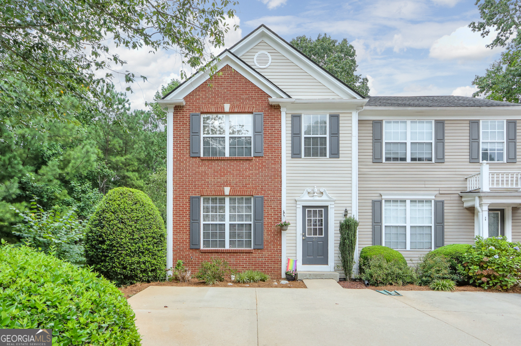 This UPDATED & END unit townhome is in a PRIME, Johns Creek location and offers an OPEN CONCEPT main level living! The entrance foyer leads into your large, gourmet kitchen that's updated with granite counters, tile backsplash, stainless appliances, and has an open view to the FIRESIDE family room. There's plenty of space to entertain or spend time with family on this main level which also features a dining room & a half bath. The master suite is upstairs and features VAULTED ceilings, a WALK-IN closet, and an updated bathroom with double vanities and ceramic tile floors. Two additional bedrooms are upstairs that share a full bathroom. And there's more - a FULL, FINISHED BASEMENT - such a RARE thing to find for townhomes in this area - and it offers a huge media room along with a separate bonus room/possible 4th bedroom! You'll enjoy spring and fall evenings on your NEW DECK which has a beautiful view of the woods. You're in the perfect spot in the community - tucked back at the end of the cul-de-sac with a private back yard. Some additional upgrades and features include a NEW ROOF, NEW HVAC, NEWER CARPET, FRESH INTERIOR PAINT, and beautiful laminate, wide-plank HARDWOODS on the main level. The location can't be beat with close proximity to GA 400, schools, shopping, dining and all that Johns Creek, Roswell & Alpharetta have to offer! This is honestly a rare find!