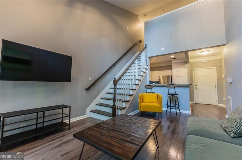 Welcome to a truly one-of-a-kind, top-floor condo at The Enclave at Briarcliff, where style, comfort, and convenience come together. This impeccably maintained condo features soaring two-story ceilings that create an open, airy atmosphere, while modern upgrades like granite countertops, stainless steel appliances, smart home technology, and rich wood flooring add luxury to every space. The spacious one-bedroom floor plan is complemented by a versatile bonus loft, perfect for a home office, guest area, or creative space. Enjoy exclusive access to resort-style amenities, including a pool, fitness center, tennis courts, a two-acre park, private movie theater, on-site management, and secure gated entry. All of this is just steps from the new billion-dollar Children's Hospital and minutes from Emory, the CDC, and Brookhaven.