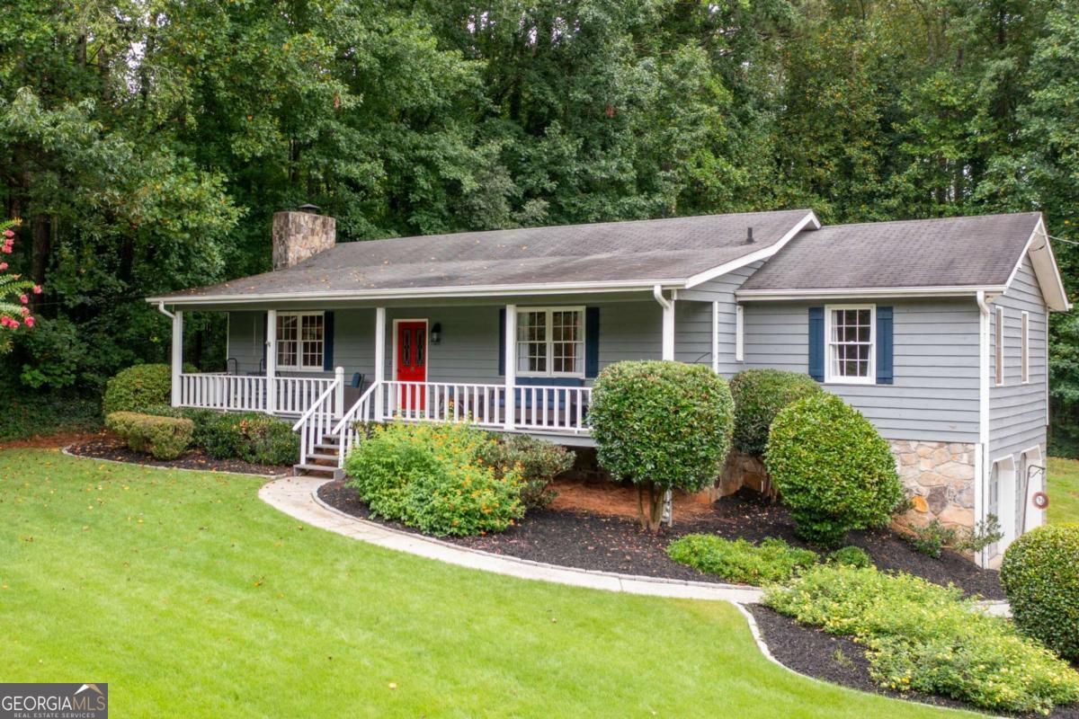 Charming and well-maintained home in a quiet, established neighborhood with no HOA. This property features 3 spacious bedrooms, 2 full bathrooms, and two masonry fireplaces-one on the main level and another in the finished basement bonus room. There's also unfinished basement space ready for your custom touch-perfect for a home office, gym, or workshop. Enjoy outdoor living with an inviting front porch, rear deck, and a completely private, professionally landscaped backyard. Gather around the fire pit-perfect for cozy fall evenings, and keep your lawn green with the irrigated front yard. A large storage shed and dedicated RV/boat/trailer parking provide added flexibility. Located in the top-rated West Cobb school district and just minutes from The Avenue at West Cobb for premier shopping and dining-this home truly has it all!