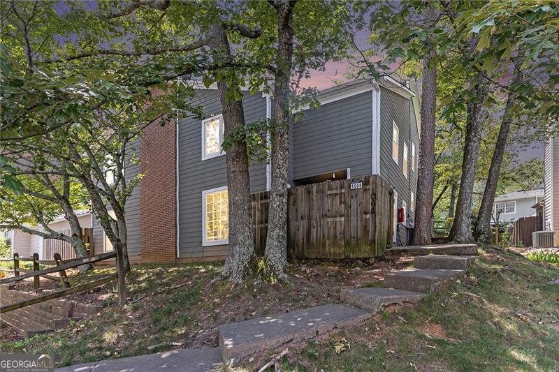 Affordable. Upgraded. Convenient. This 3 bed, 2 bath condo in Norcross, GA is the perfect opportunity for a first-time homebuyer or savvy investor. Located just minutes from I-85 and under 30 minutes to both Downtown Atlanta and Hartsfield-Jackson International Airport, this home offers unbeatable access to everything metro Atlanta has to offer. Step inside to find a blend of hardwood floors and cozy carpet throughout, an upgraded bathroom, and spacious living areas filled with natural light. Enjoy low-maintenance living in a well-kept community with plenty of green space. VA buyers take note ? this property includes an assumable 3.1% loan, making it even more attractive in today's market! Don't miss your chance to own in one of Gwinnett County's most connected locations.