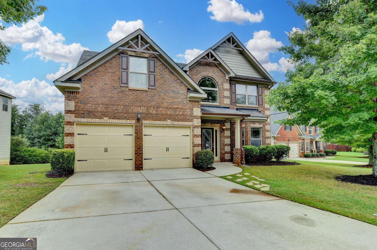 Spacious and Luxurious Home, offering a wonderful floor plan, two story foyer, formal dining room with coffered ceiling. Large one story great room with a stone fireplace, open a sunny and bright breakfast area, well equiped kitchen featuring new appliances, also a refrigerator, granite counter tops and upgrated stain cabinets! Upstair features an elegant and spacious owners retreat, featuring a walk-in closet, also offers a private room for relaxation and leisure enhancing the functionality of the owner suite! a luxurious bath w/double vanities, soaking tub and seperate shower. # additional large bedrooms all with cathedral ceilings creating a very spacious feeling. Extensive trim through out! All new carpet, freshly pinted inside and out. Great schools, with in walking distance to the Gwinnett Enviromental Heritage Center featuring walking trails, greenways, nature tree top quest and so much more! Great Location to Lake Lanier, Mall of GA, so many restaurants.
