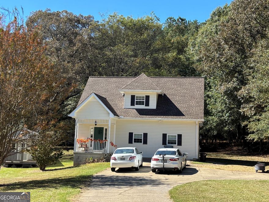 Interested in having some acreage but not too much. This 2-bedroom home with 2.5 bathrooms has approximately 1.24 acres. There is a gravel area out in front of the home for your firepit and space for a table and chairs. As you enter the home, you step into the great room. Down a small hallway, from the great room, is a full bathroom.  The kitchen is located off this area with a door to the side of the home. The main bedroom is located on the main level with a 1/2 bathroom and plenty of closets and space to put your recliner to relax in.  As you venture upstairs, you will find an additional nice great room and large bedroom, full bath and surprise another kitchen. There is storage space in the eves off of this floor.    In the back yard is a large storage building for you to have a storage shed, man cave or just let your imagination make it what you want!