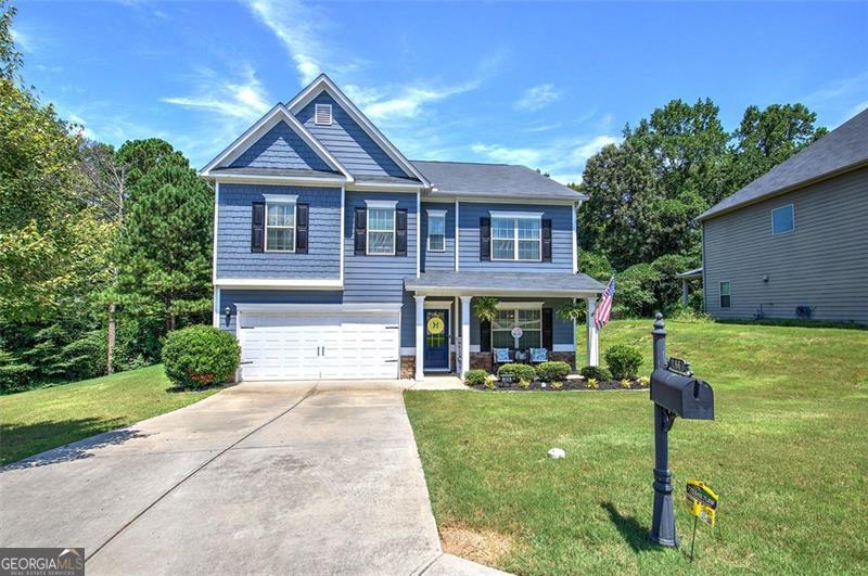 Welcome to your dream home in sought-after Stonewood Creek, nestled in a quiet cul-de-sac in the top-rated North Paulding school district. This spacious 4-bedroom, 3.5-bath, two-story stunner offers over 3,000 square feet of thoughtfully designed living space-perfect for growing families, entertaining, or simply spreading out. Step inside to find a completely remodeled kitchen with a custom walk-in pantry, modern finishes, and a layout that flows seamlessly into the open-concept main floor. Durable and stylish LVP flooring runs throughout the main level, complemented by fresh paint on every wall and ceiling. A separate formal dining room offers space for holiday gatherings or dinner parties, and the dedicated mudroom keeps things clean and organized. Upstairs, the oversized primary suite includes a cozy sitting area-ideal for a home office, nursery, or reading nook. The generous loft provides even more flexible living space, and the secondary bedrooms are spacious, light-filled, and well-appointed. With 3.5 bathrooms, morning routines are a breeze. Outside, enjoy one of the largest covered patios in the neighborhood-ideal for grilling, relaxing, or hosting game days rain or shine. The exterior has been freshly painted, and the cul-de-sac lot offers privacy and low traffic. Stonewood Creek is a lifestyle neighborhood with resort-style amenities including a community pool, playground, and tennis/pickleball courts.