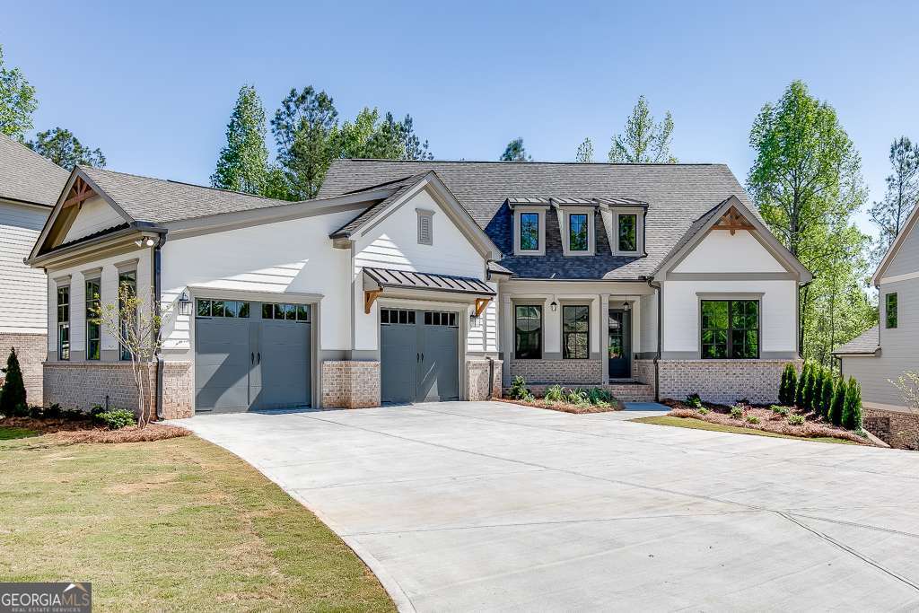 This gorgeous 4 bedroom/3.5 bath MASTER ON MAIN built by Hillgrove Homes is exactly what you are looking for! FULL UNFINISHED BASEMENT W/ PRIVATE WOODED LOT. Extensive upgrades have been poured into this home including upgraded trim package and shiplap accent walls, coffered ceilings, brick fireplace w/ rustic mantle, built-in cabinetry, upgraded cabinetry w/ soft close drawers, quartz countertops, stainless steel appliance package, tile backsplash in Kitchen, farm sink, spacious walk-in pantry, rustic manor floors throughout the main living areas and Master Bedroom, and more. Desirable features will wow you like a mudroom/drop zone, cabinetry and sink in the laundry, oversized closets and plentiful storage space. This plan is built w/ TWO MASTER ON MAINS. Both Master Suite Bathrooms have luxurious walk-in tiled showers. Two secondary bedrooms upstairs w/ a Full Bath. The covered back porch overlooks a large, level and wooded backyard, site plan in the pics shows how deep the lot is and this home is located on a quiet street almost to the cul-de-sac. HIGHLY SOUGHT AFTER JACKSON COUNTY SCHOOL SYSTEM. TRADITIONS OF BRASELTON SWIM/TENNIS/GOLF/RESTAURANT COMMUNITY. Construction Complete- HOME IS READY!