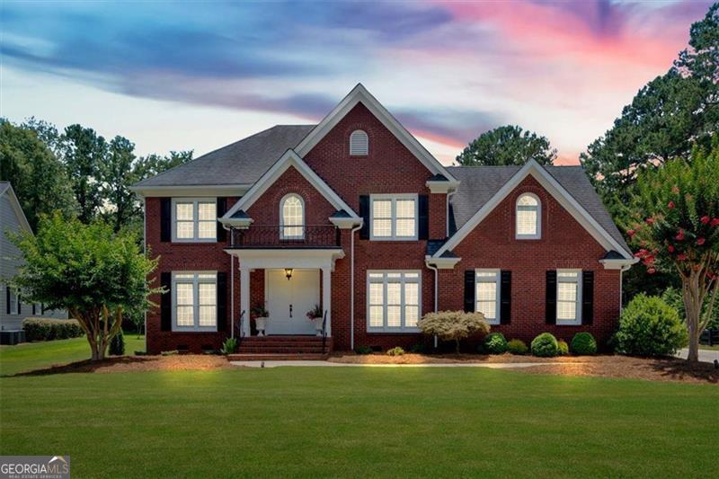 Welcome home to this beautifully updated 4-bedroom, 2.5-bath residence nestled in the highly sought-after Waterford subdivision! This two-story gem offers exceptional space, timeless upgrades, and a layout designed for modern living. Upstairs, you'll find all four bedrooms, including an oversized master suite that feels like a private retreat, complete with a spa-like master bath featuring upscale finishes and ample space to relax and unwind. The main level showcases a traditional layout with flexibility in mind-separate dining room, formal living room/den (perfect for a home office), and a cozy family room with a gas fireplace. The heart of the home is the stunning kitchen featuring crisp white cabinetry, gorgeous granite countertops, stainless steel appliances, and an open view perfect for entertaining. Throughout the home, you'll love the gleaming hardwood floors and the carefully selected updates that elevate the entire space. Including a generator that will power the whole entire home, spray in installation and many other features. Step outside to your covered patio and beautifully landscaped backyard-ideal for outdoor gatherings and even room to add your dream pool. Don't miss your chance to live in one of the area's premier communities with access to top-notch amenities!