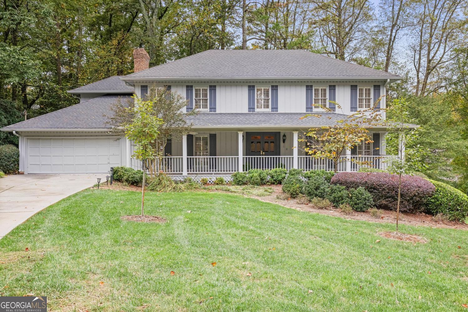 There's a certain rhythm to life in The Branches -a community where tree-lined streets meet timeless architecture and neighbors wave from wide front porches. This classic home on a peaceful cul-de-sac unfolds like a well-crafted story, each room adding warmth and character. Lovingly maintained by its original owner, this home has long served as a cherished setting for gatherings, celebrations, and meaningful connections-a place where memories were made and stories shared.  The curb appeal sets the tone with a level green lawn and a welcoming front porch,  Step inside and find a family room framed by built-in bookshelves, a fireplace, and a wet bar perfect for gathering or quiet reflection. Sunlight pours through the skylit sunroom, flowing effortlessly onto the newly stained deck where the private backyard becomes an outdoor stage for weekend grilling and conversation. There is also room for a pool if desired!  The renovated kitchen balances beauty and function with quartzite countertops, crisp white cabinetry, tile backsplash, and stainless-steel appliances, all designed with an eye for detail.  Fresh paint throughout and hardwood floors carry throughout the main level and primary suite, while plantation shutters add an elegant touch. Upstairs, the spacious primary suite offers a tray ceiling, dual vanities, soaking tub, walk-in shower, and two closets with room to add a second laundry if desired. Three additional bedrooms share a well-appointed bath with tub/shower combination.  Flexible living spaces await in the terrace level complete with a wet bar, full bath, and additional bedroom, ideal for a studio, gym, or creative retreat. The unfinished area adds storage and potential for a second laundry room.  Optional membership at The Branches Club provides access to an active swim and tennis community with pool, clubhouse, playground, and lighted courts. Conveniently close to Dunwoody Village, Ashford Lane, and High Street for shopping and dining, with easy access to GA-400 and I-285.  Top schools.  A residence filled with warmth, joy, and countless memories awaits the next fortunate owner.  More than just a house-it's a haven. A place to feel grounded, connected, and truly at home.