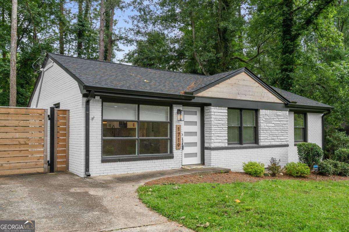 This beautifully renovated 3-bedroom, 2-bath home in Belvedere Park is located in a quiet neighborhood and is truly a great house. It features an updated HVAC system, tankless water heater, and refreshed kitchen and bathroom cabinets. Step through the stylish 5-light front door into the open-concept great room, highlighted by refinished hardwood floors throughout. The kitchen includes a peninsula island with seating for up to four, quartz countertops, and stainless-steel appliances. The owner's suite offers an en-suite bathroom with a vanity featuring an off-set sink for added counter space, a frameless shower, and a walk-in closet. The backyard is fenced on and features mature trees and a patio deck, ideal for relaxing or entertaining. The home also includes upgraded lighting throughout and smart home starter features such as a video doorbell and a security floodlight camera. Located in Belvedere Park, this great home offers convenient access to I-20, I-285, Glenwood Road, and Memorial Drive, with close proximity to Avondale Estates, downtown Decatur, East Atlanta, and East Lake Golf Course.