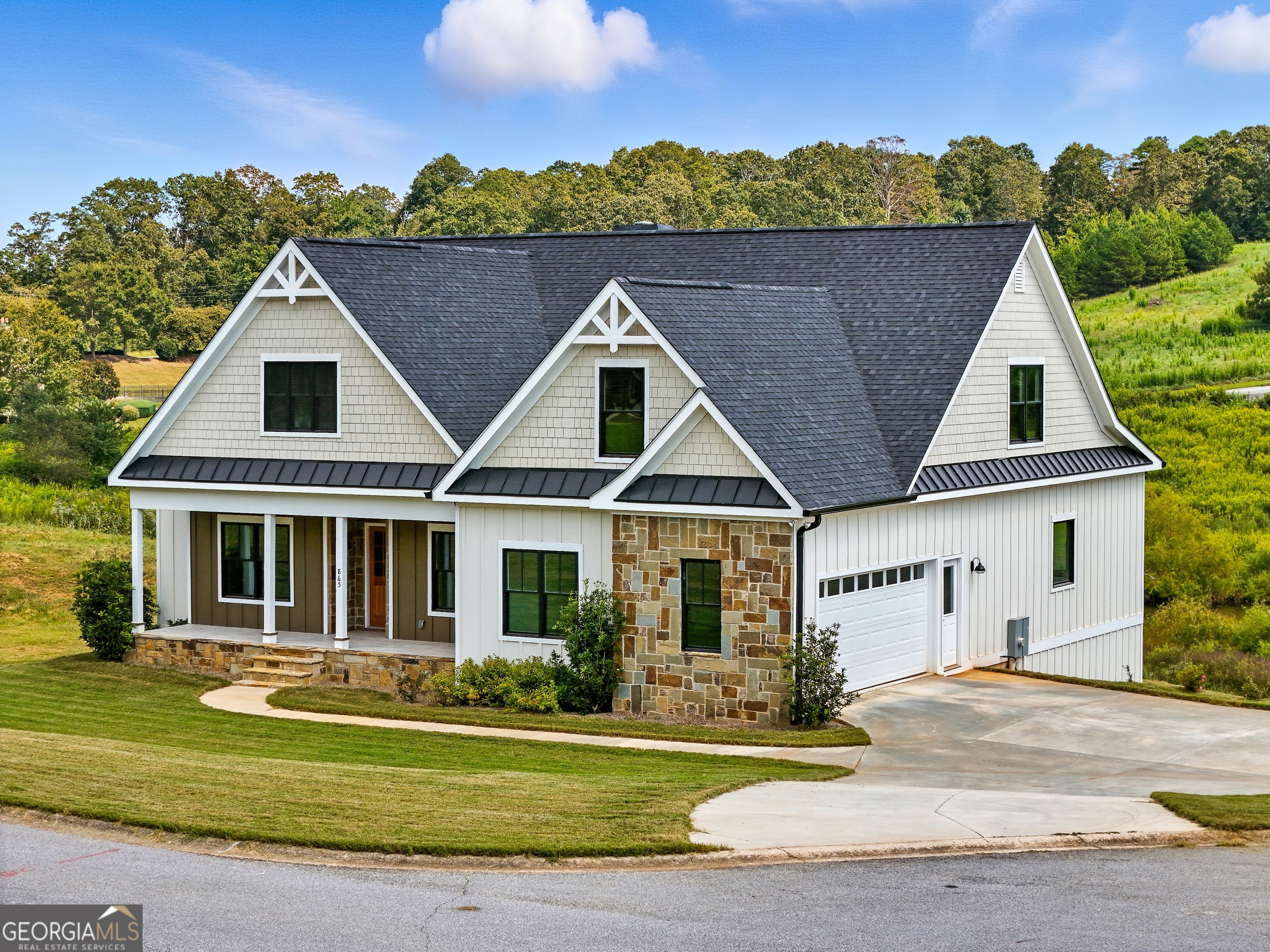 Welcome to this stunning 1.5 story ranch with a full basement, nestled in the foothills of the Blue Ridge Mountains. Perfectly positioned on one of the community's few remaining premium cul-de-sac lots with a tranquil pond view, this home offers a serene retreat with unmatched style and quality. The builder spared no expense, showcasing premium finishes throughout-from Blue Wood Pine and tongue & groove pine ceiling and wall accents, to soaring 12' Blue Wood coffered ceilings and natural stone masonry details inside and out. The gourmet kitchen is a true showstopper with leathered quartz countertops, Maytag stainless steel appliances, under-cabinet lighting, and abundant space for entertaining. Luxurious touches continue throughout the home, including a tankless water heater, Belgard paver terrace-level patio, and thoughtfully designed living spaces. Situated on city sewer and crafted with timeless detail, this 4-bedroom, 3-bath residence in Sweetgrass combines rustic elegance with modern comfort. Don't miss the opportunity to experience this exquisite home and its breathtaking setting!