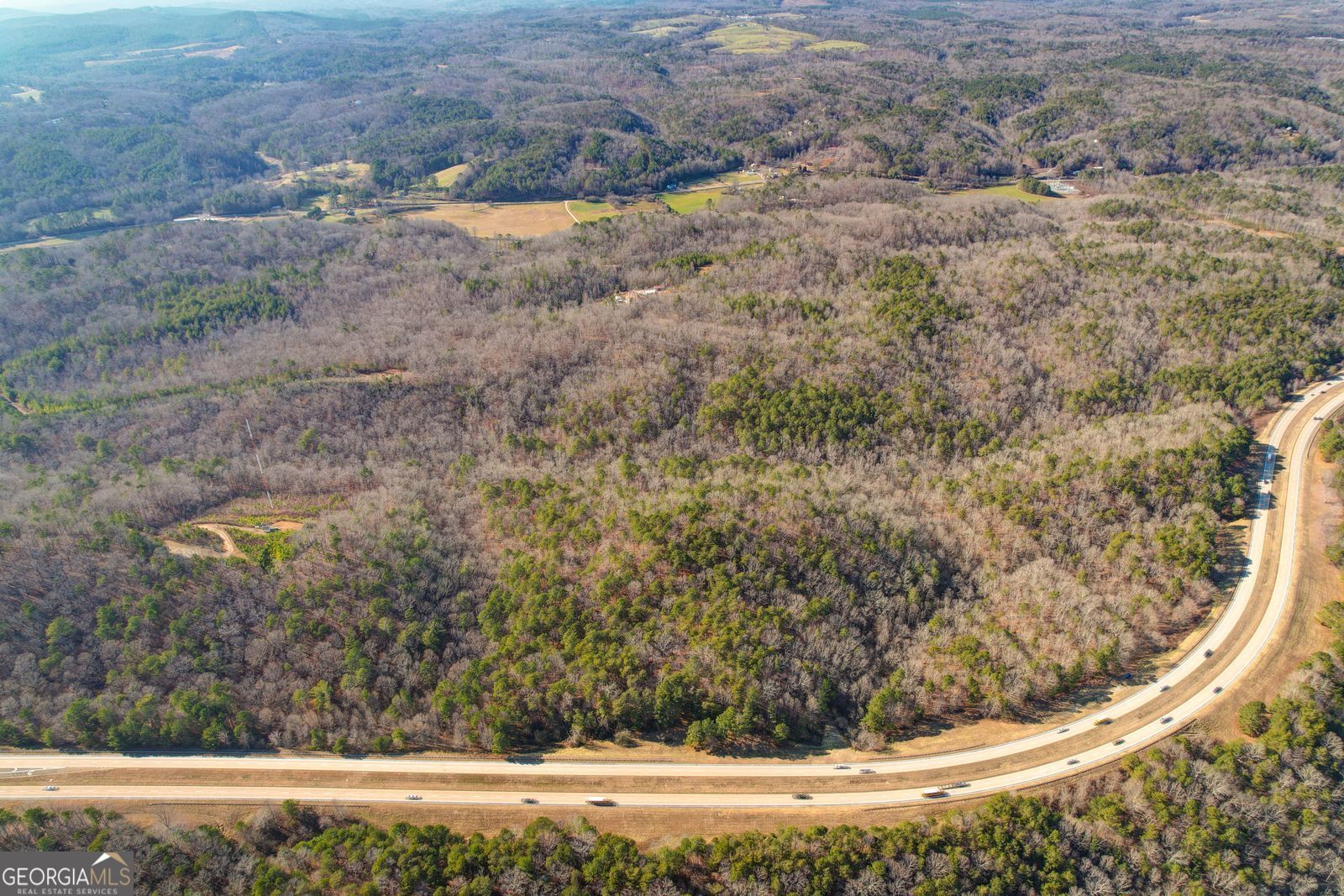 Attention all Global Investors, Developers, and Visionaries! Don't miss the opportunity to own 40+/- acres on ever increasingly busy and expanding Highway 515 South. With the high volume of traffic, growth of Jasper, Talking Rock, Ellijay, and the whole North Georgia corridor, the opportunities are endless. This tract has D.O.T. access and very close by turning lanes for excellent ingress and egress. Existing utilities are available at back side of the property, and it can be zoned commercial, residential, industrial, special use, and office. The potential use and possibilities are fantastic. Great for Amazon, storage facilities, service industries, medical centers, vineyards, and or warehouses. Sellers may even consider some owner financing with credit worthy purchasers.